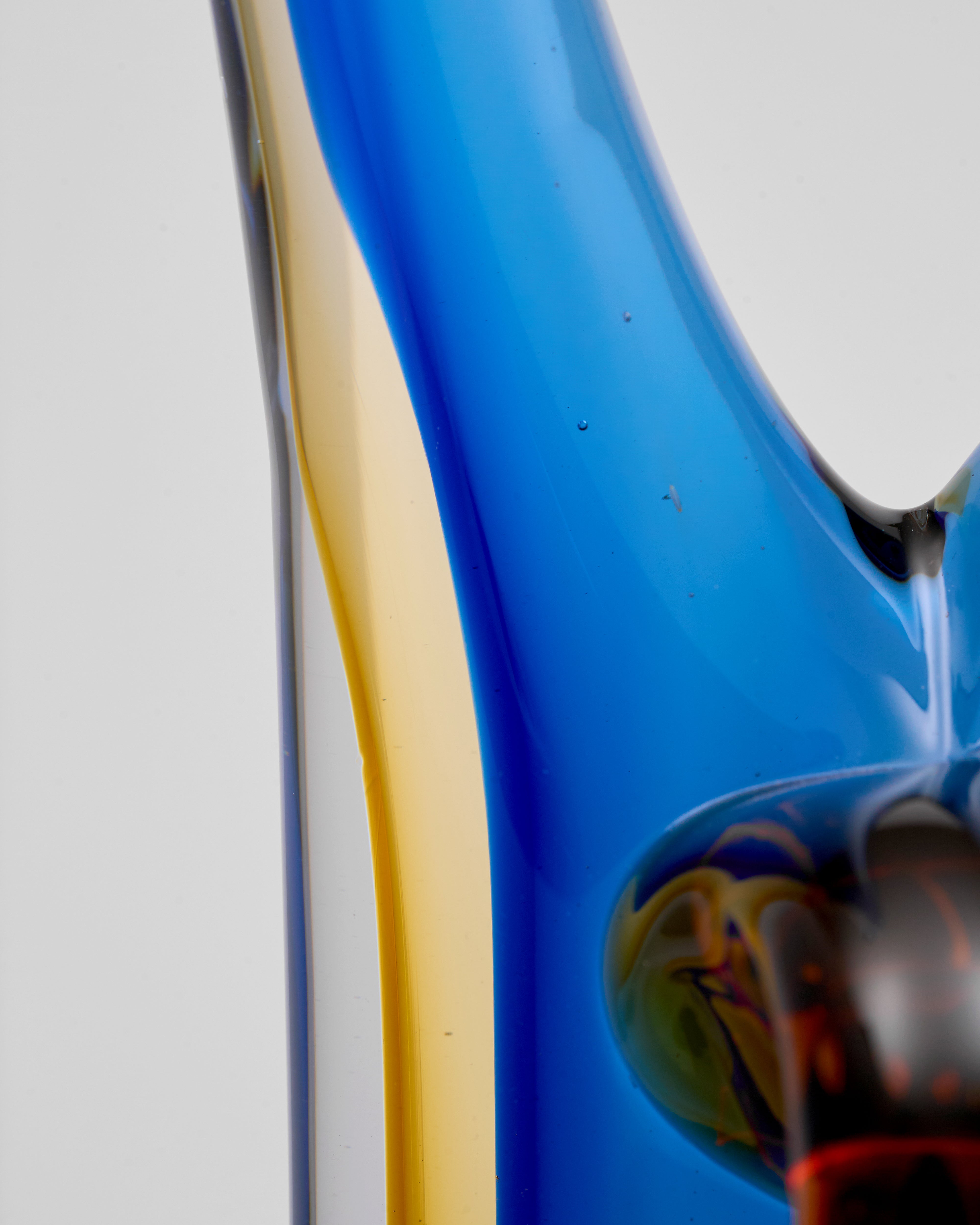 Close-up of a blue and gold object with a reflective surface