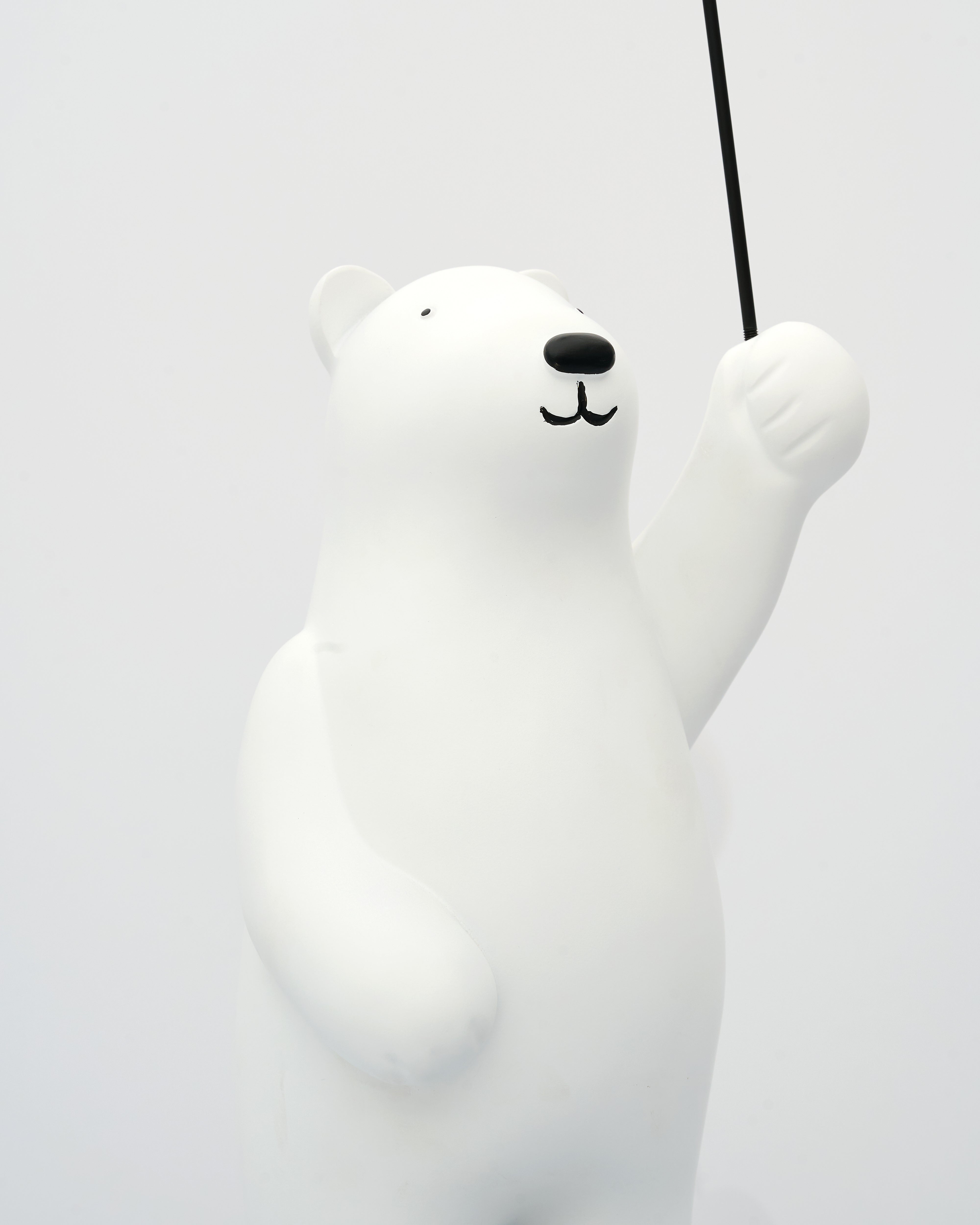 White bear-shaped lamp on a white background