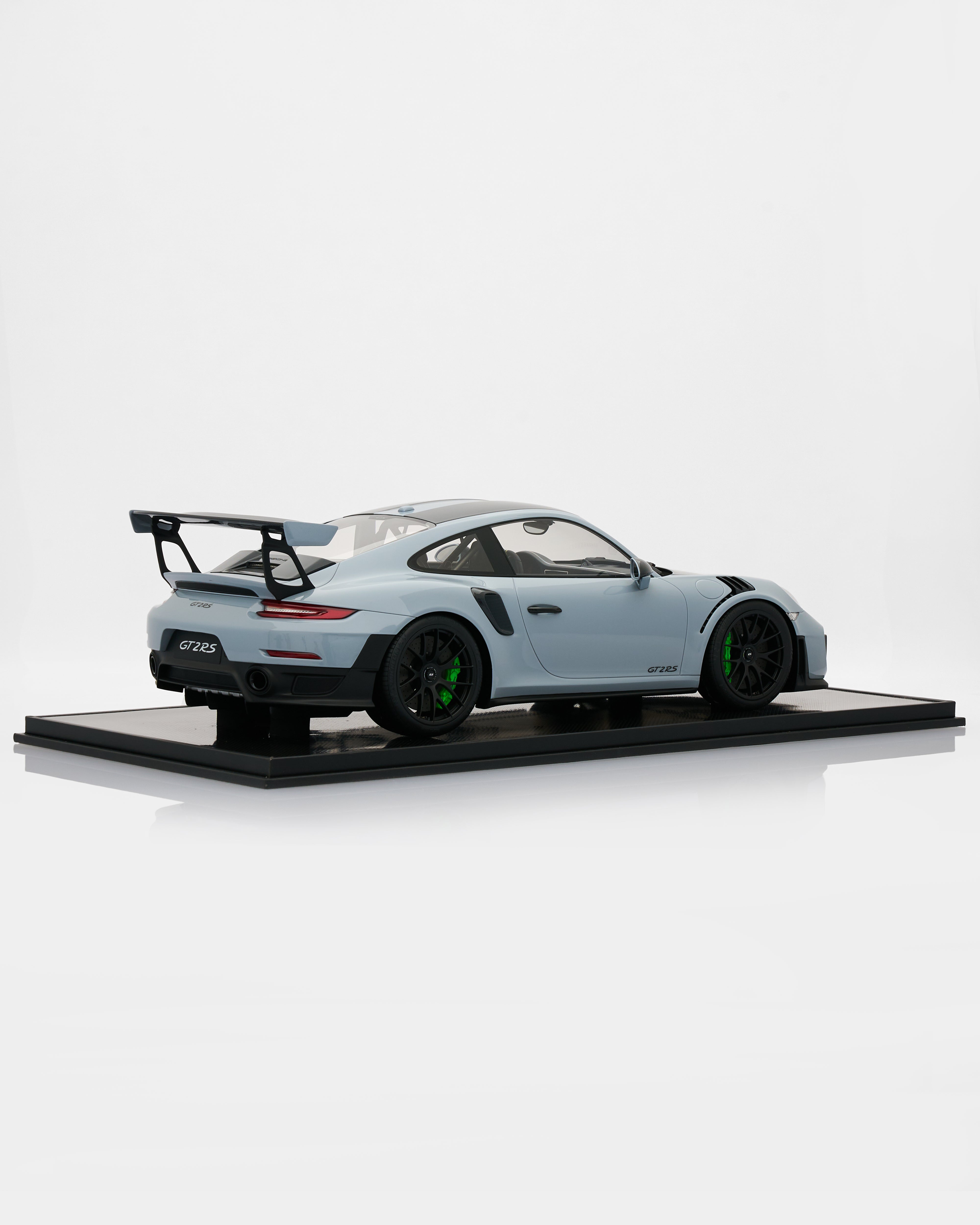 Porsche 911 GT2RS Chalk Gray Model car on a display platform with a white background