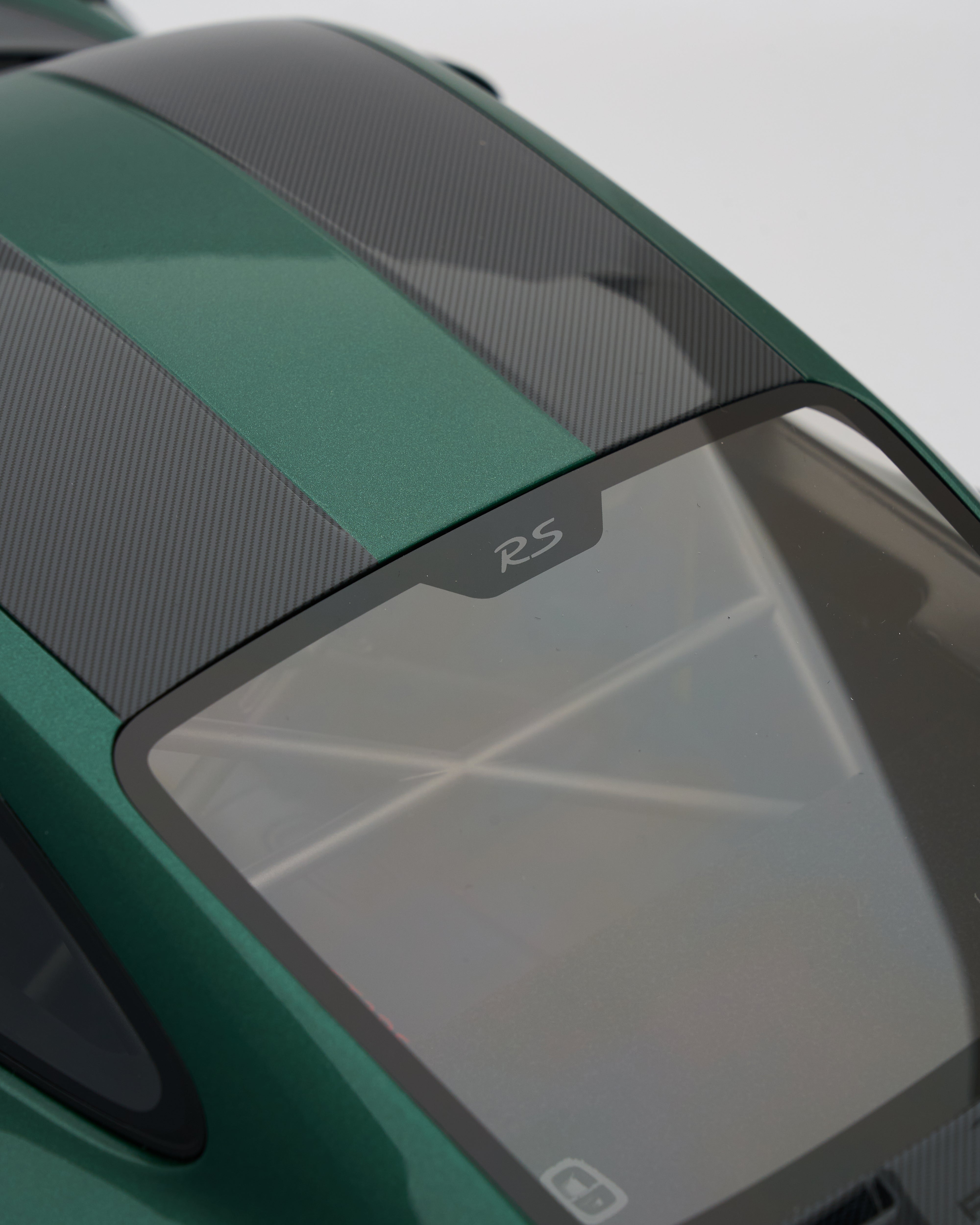 Close-up of  Porsche 911 GT2RS Irish Green car's roof with 'RS' badge on a green vehicle