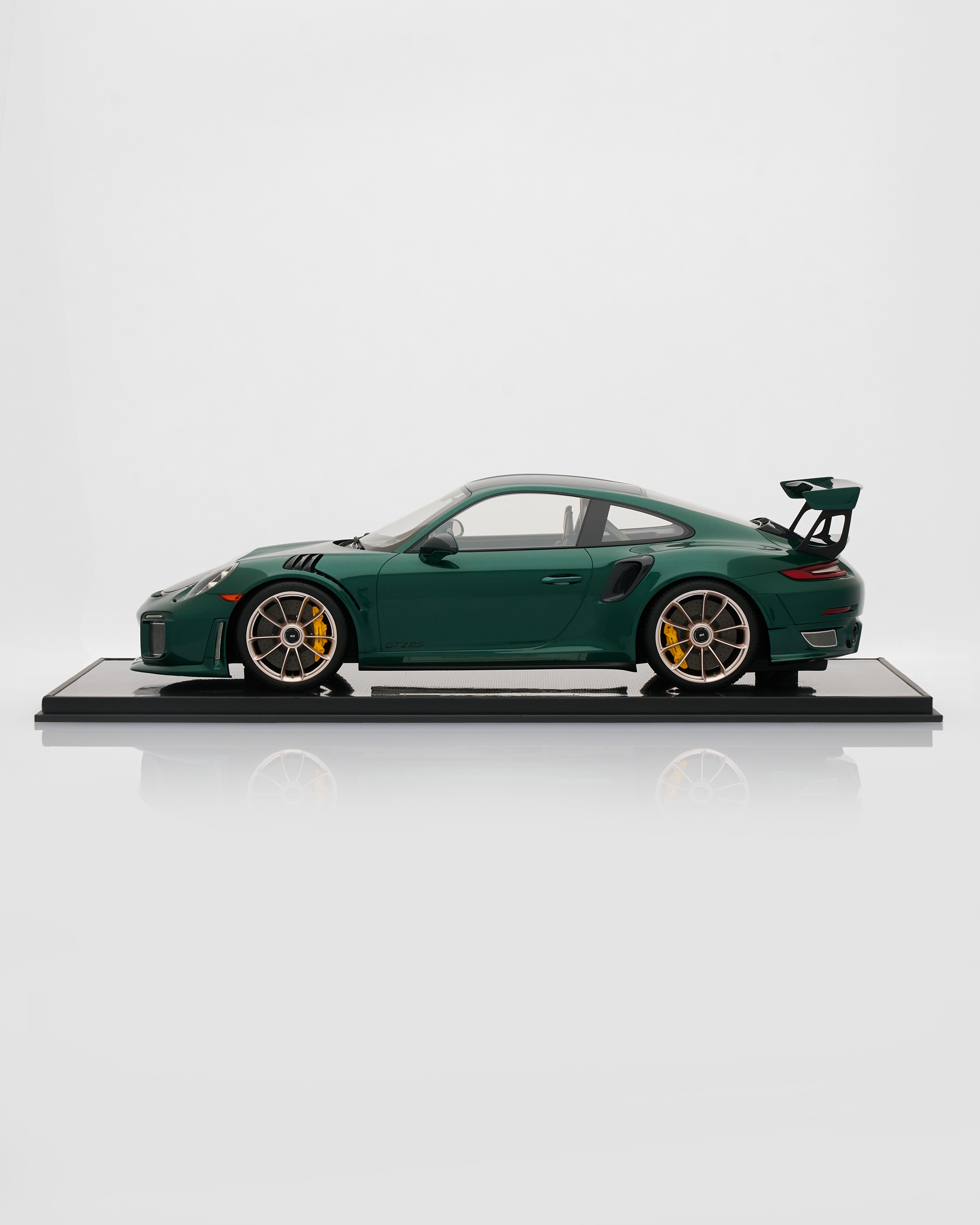 Model of a green sports car on a white background