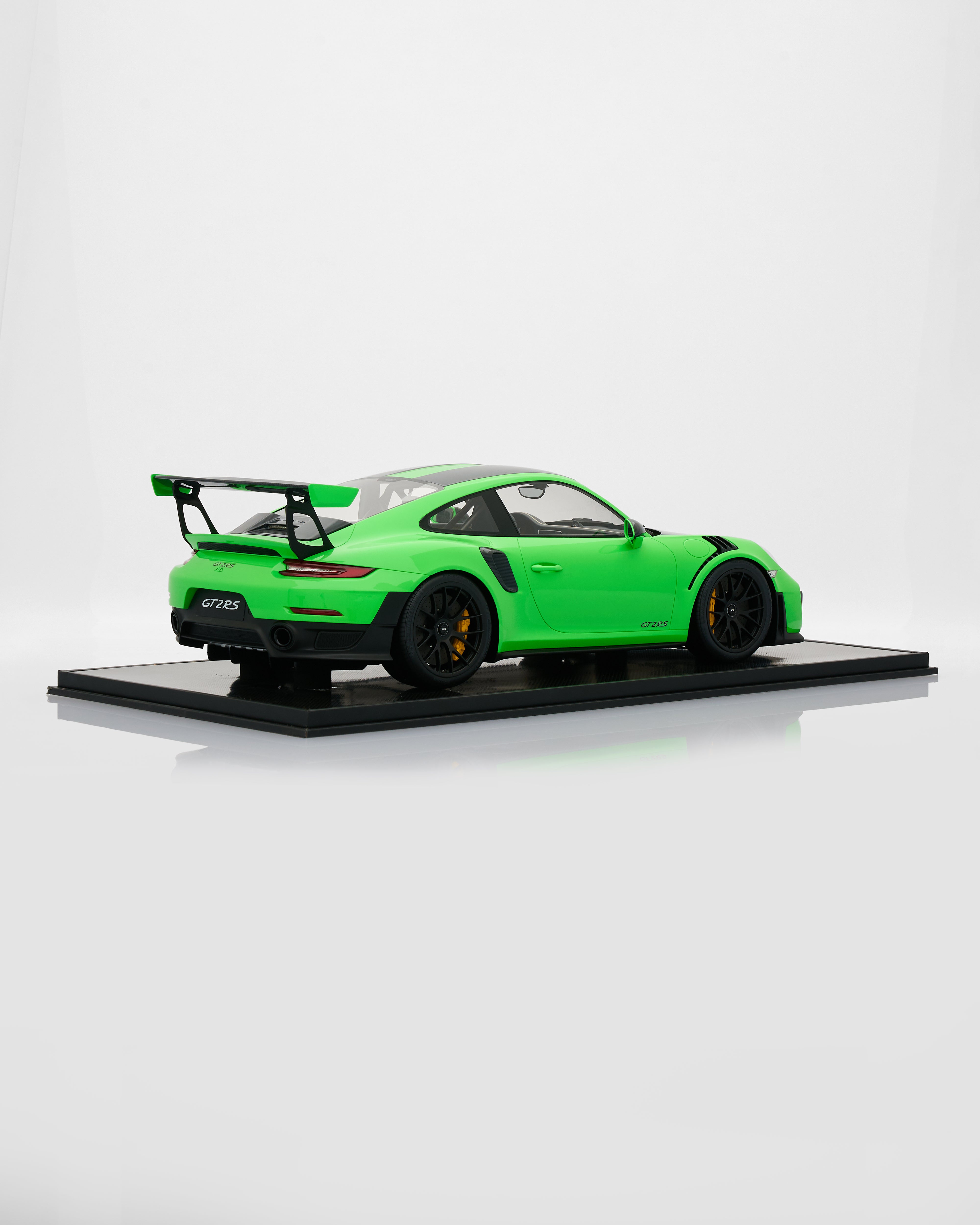 Green model car Porsche 911 GT2RS Viper Green on a white background
