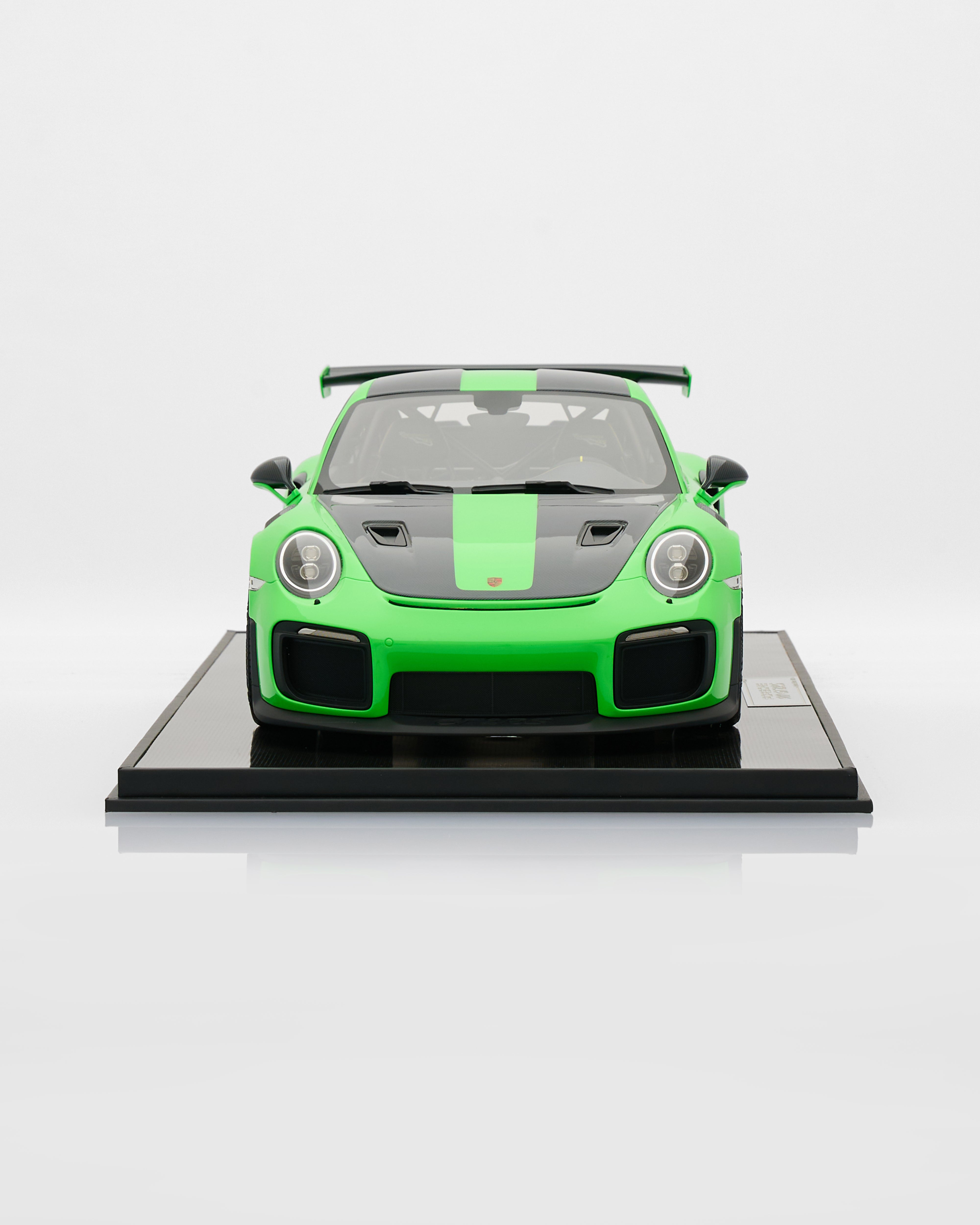 Model car on a display stand with a white background