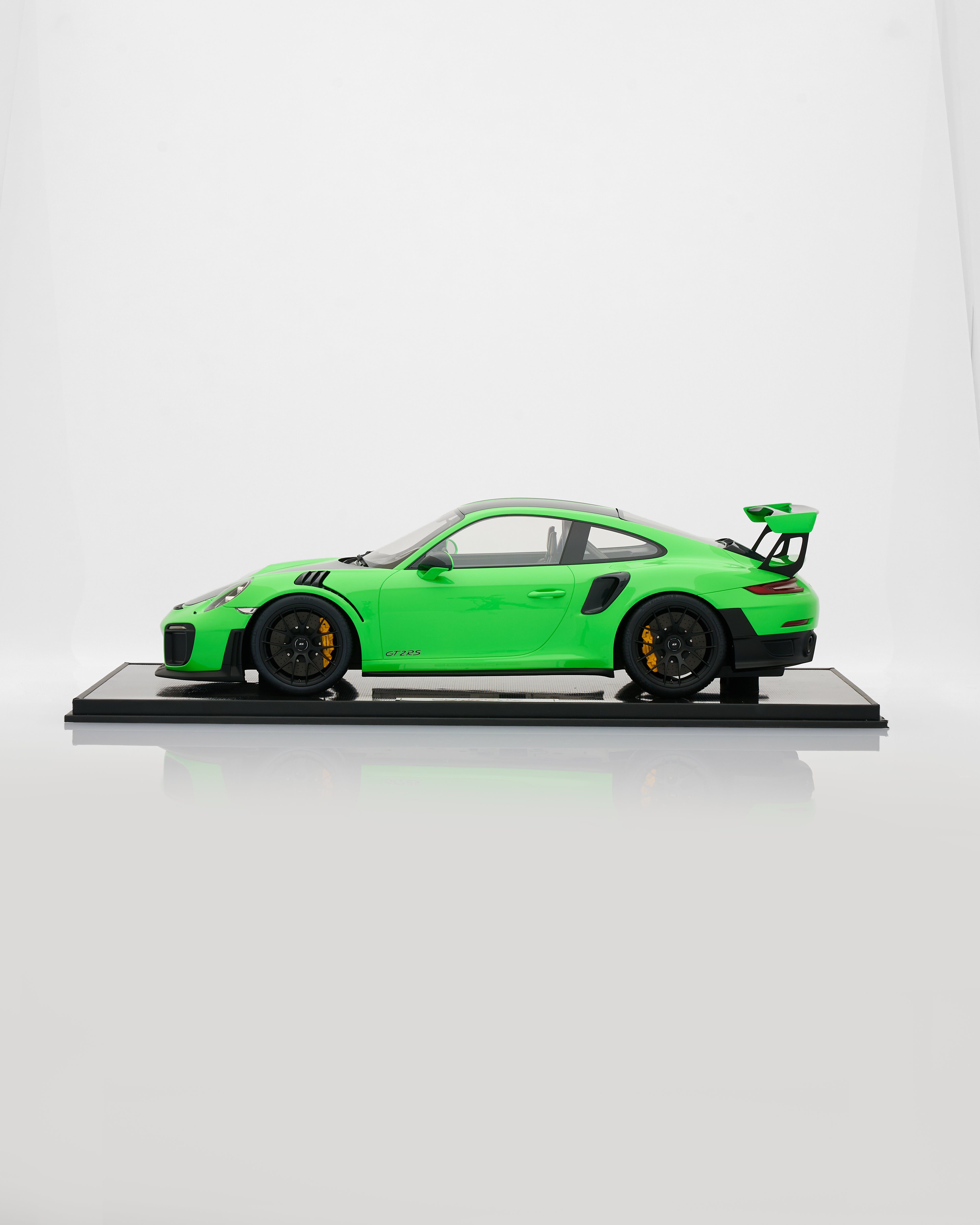 Green model car on a white background