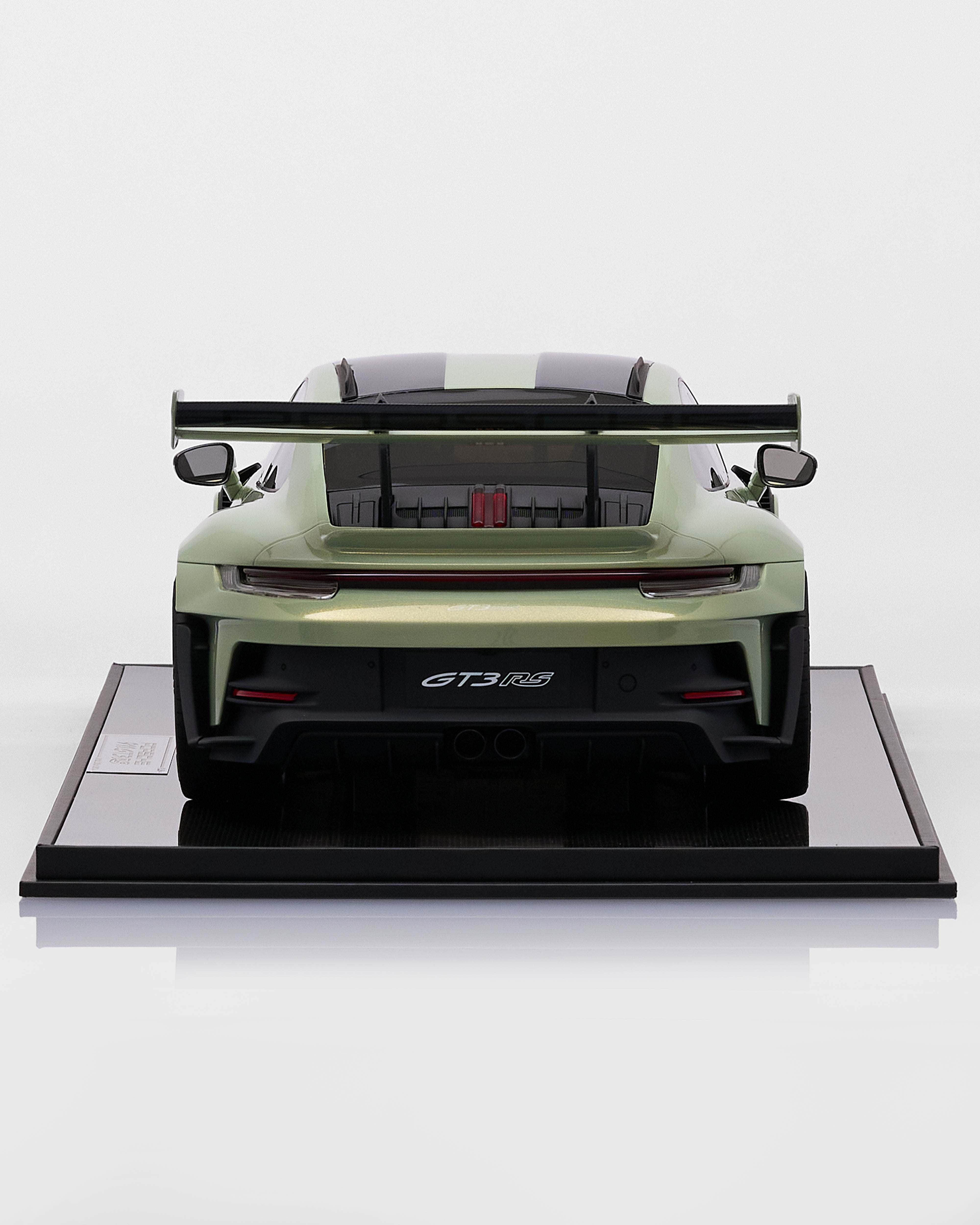 Model of a green sports car on a white background