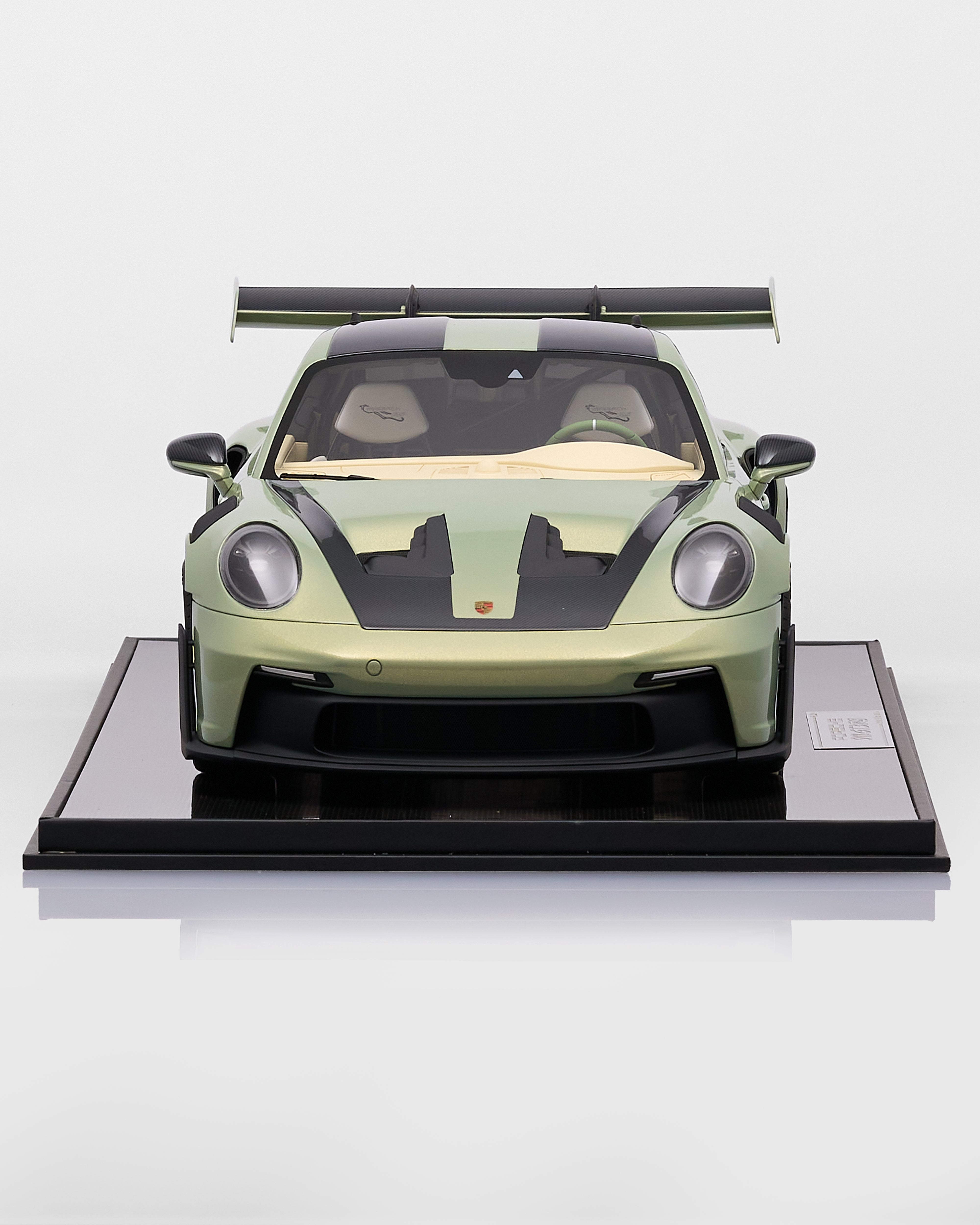 Model of a green sports car Porsche 911 GT3RS Nato Olive Green  on a white background
