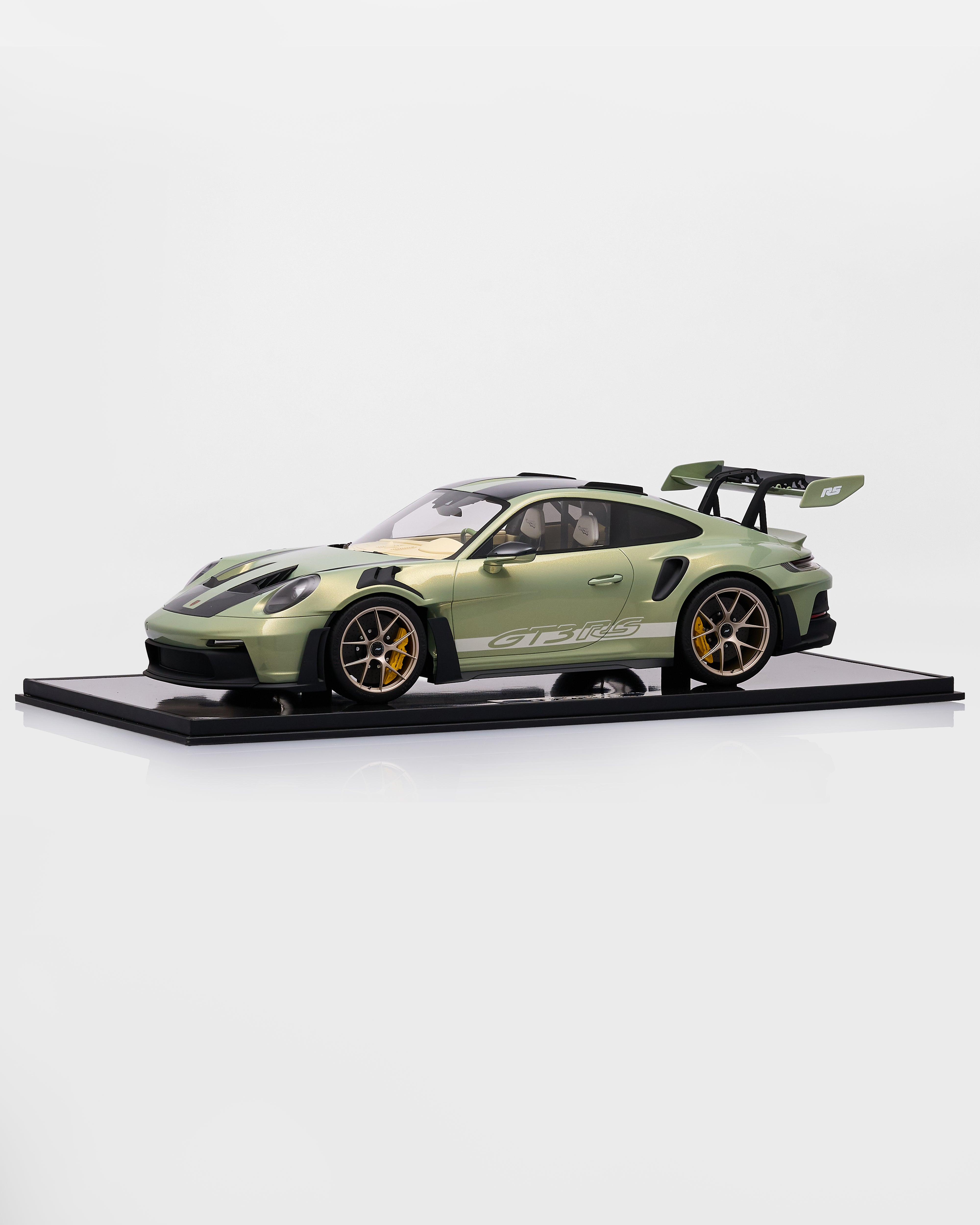 Model of a green sports car Porsche 911 GT3RS Nato Olive Green  on a white background