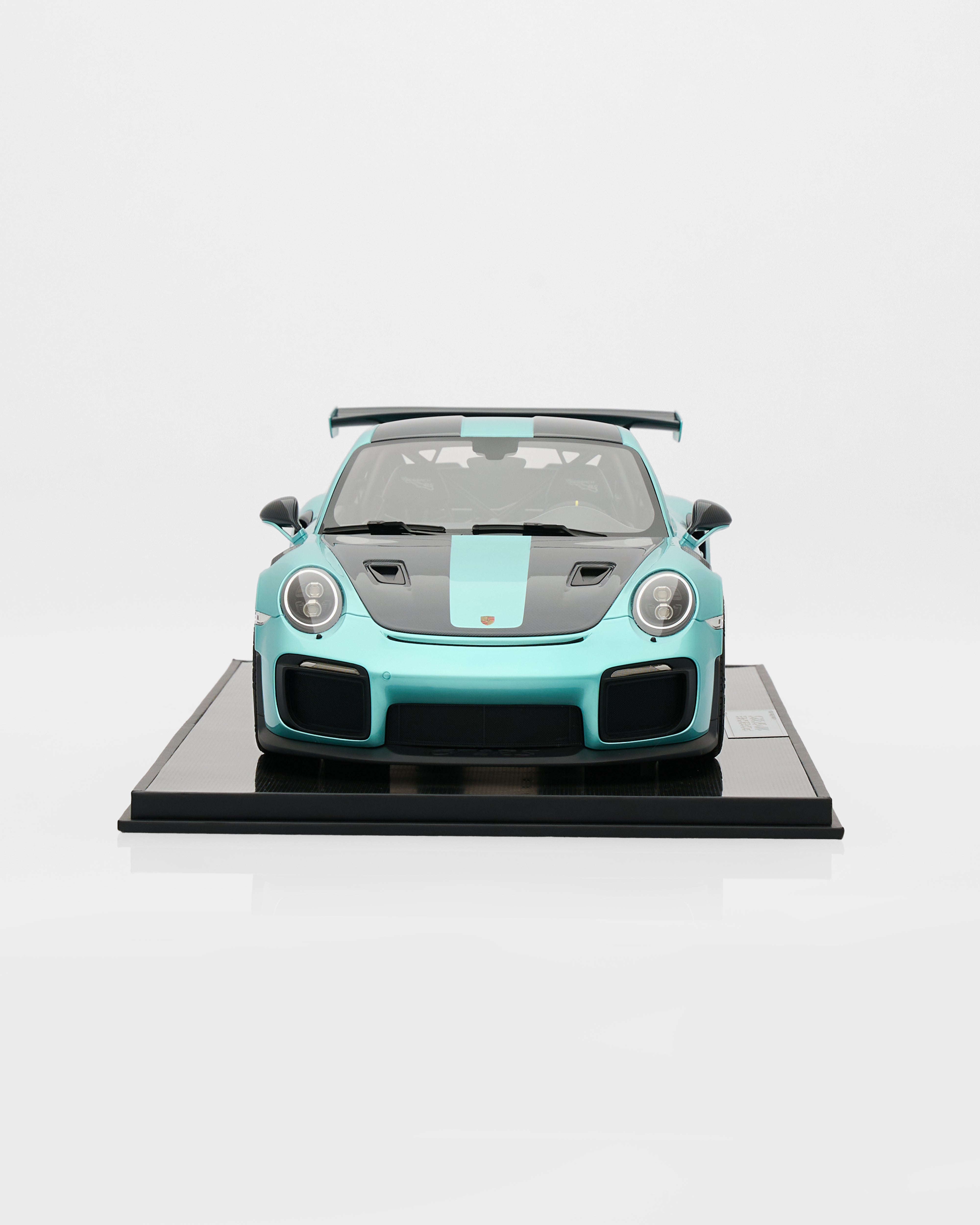 Model of aPorsche GT2RS Mint Green - Limited Edition 19/20  sports car on a black platform with a white background