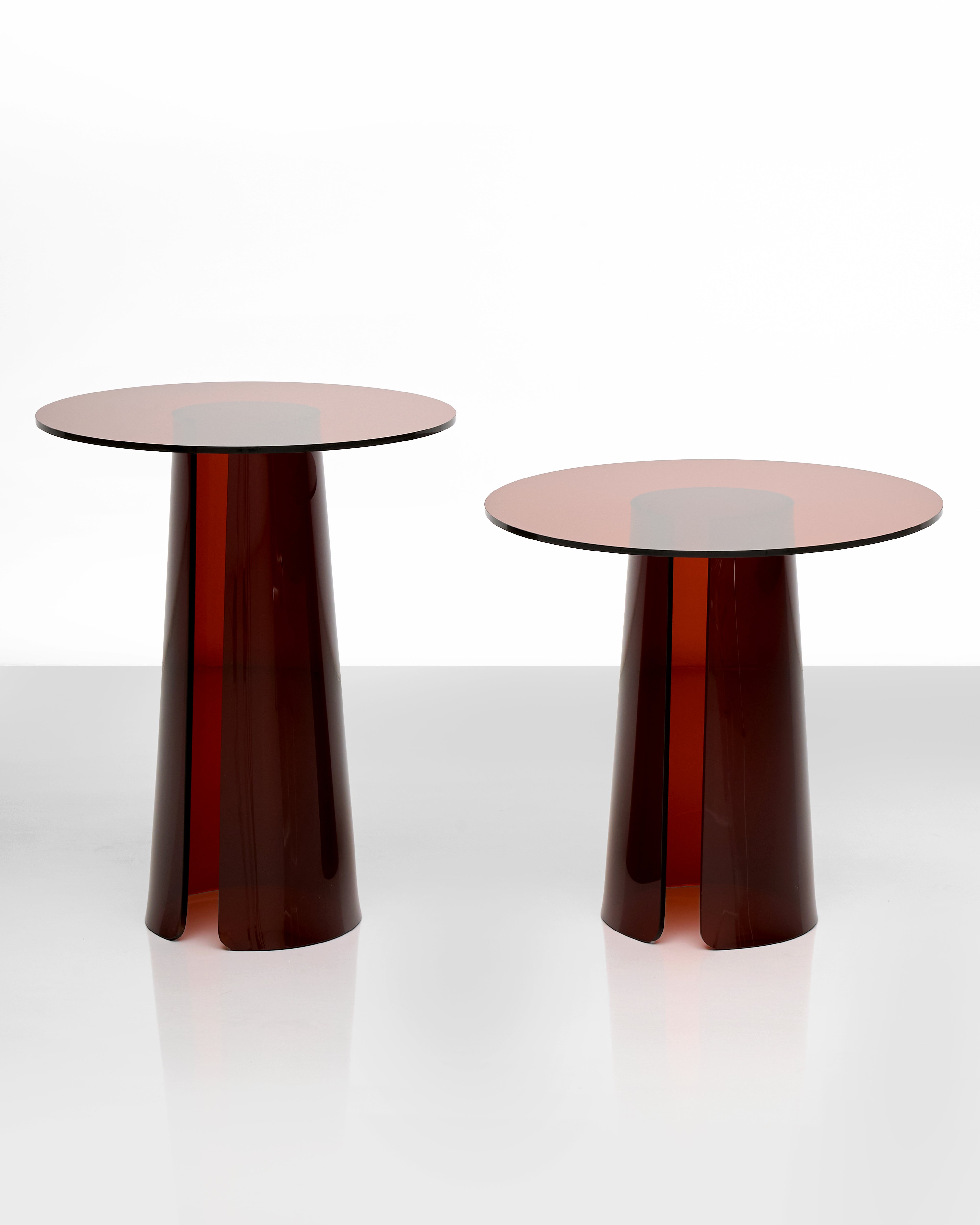 Two modern side tables with a glossy finish of acrylic on a white background