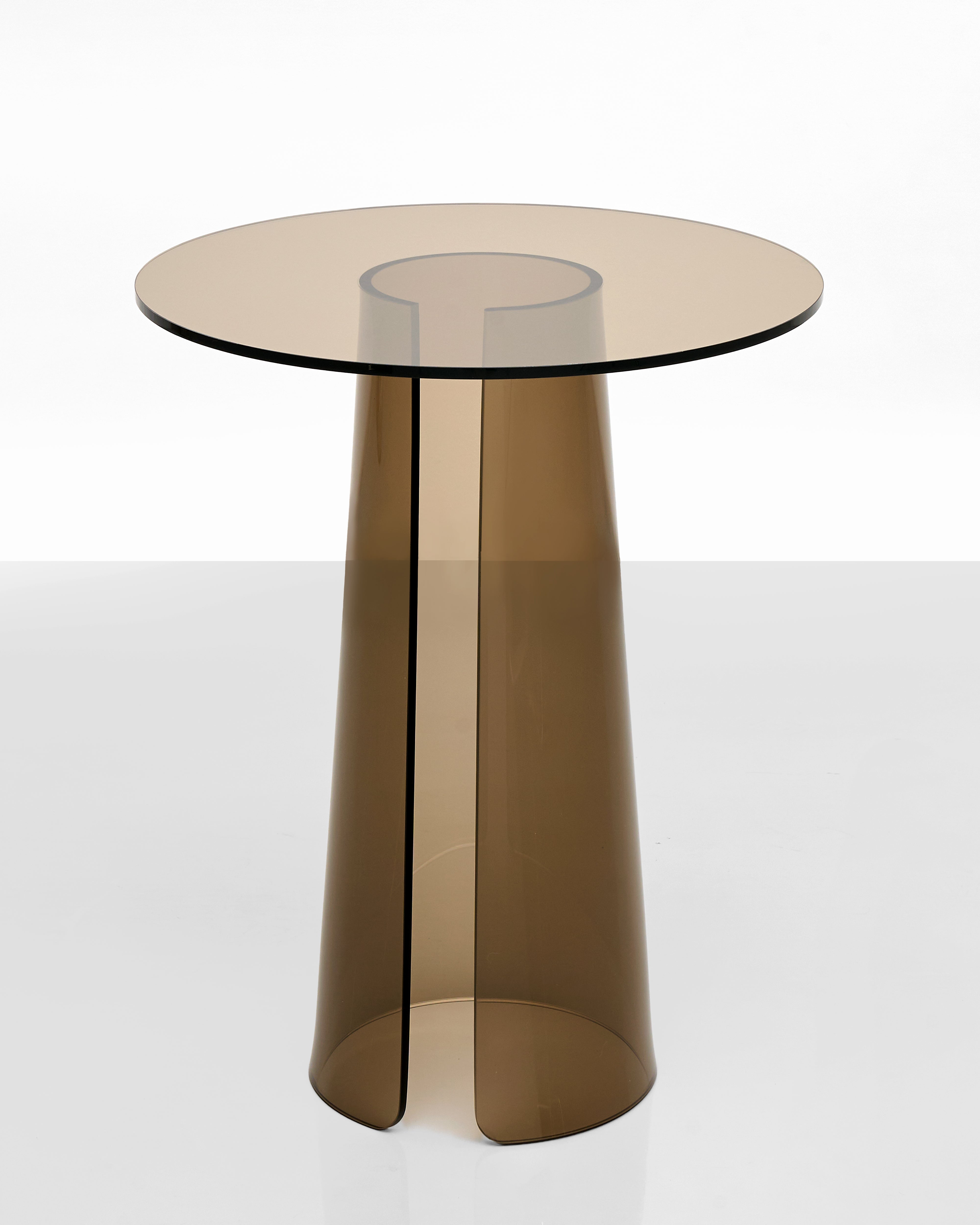Modern side table with a transparent brown base on a white background