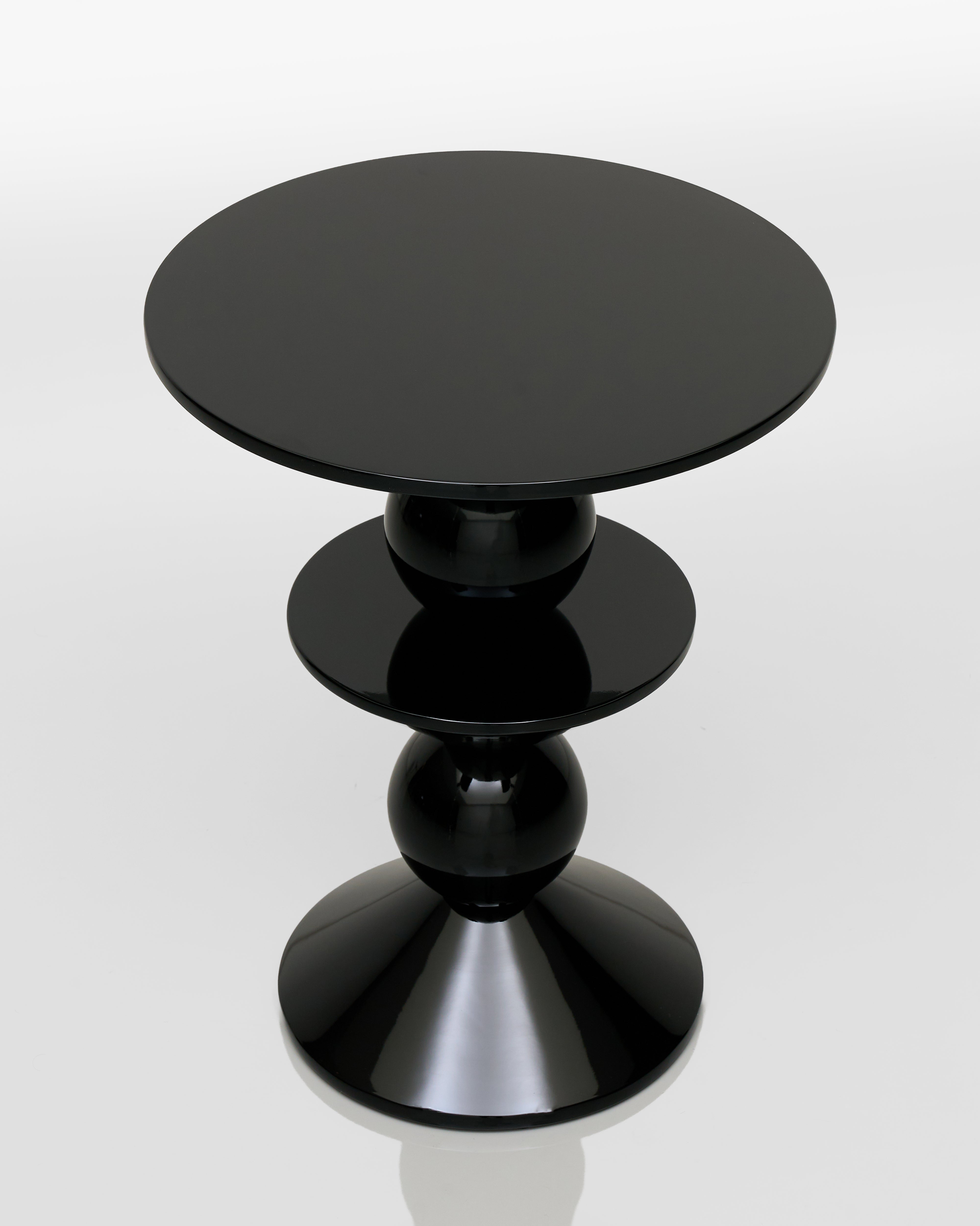 Black cylindrical table on a white background