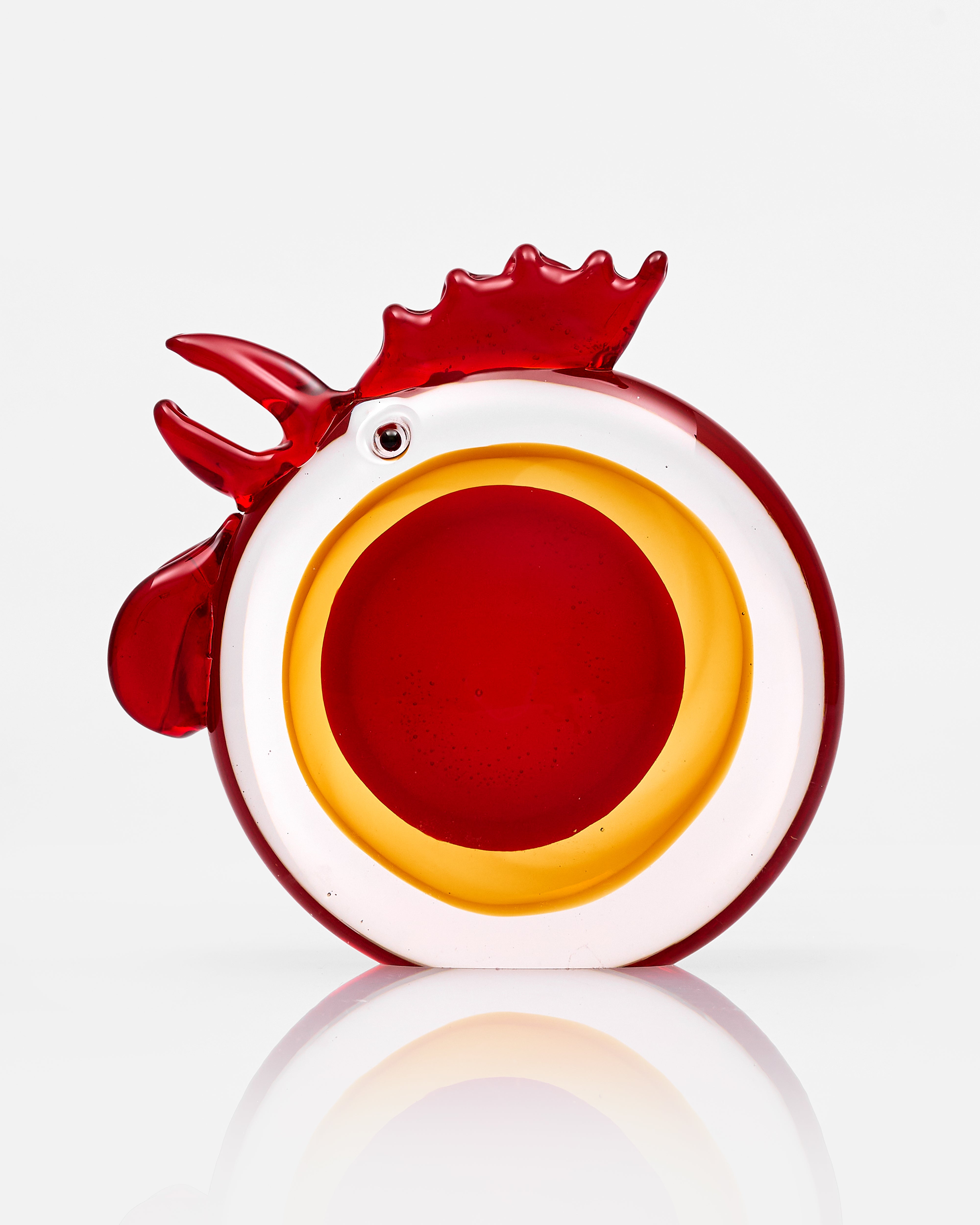 Decorative item shaped like a rooster on a white background