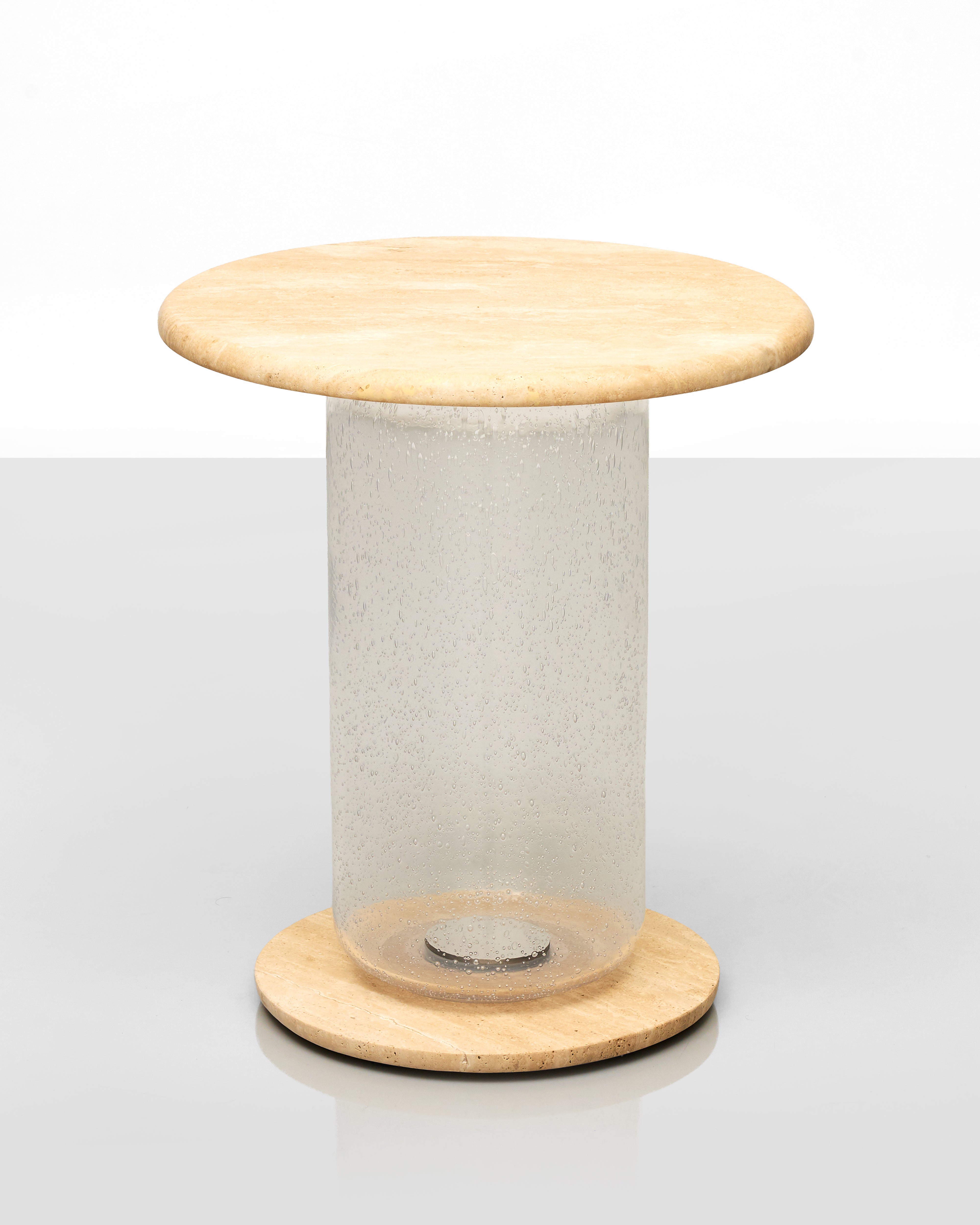 Small round wooden table with a cylindrical concrete base on a white background