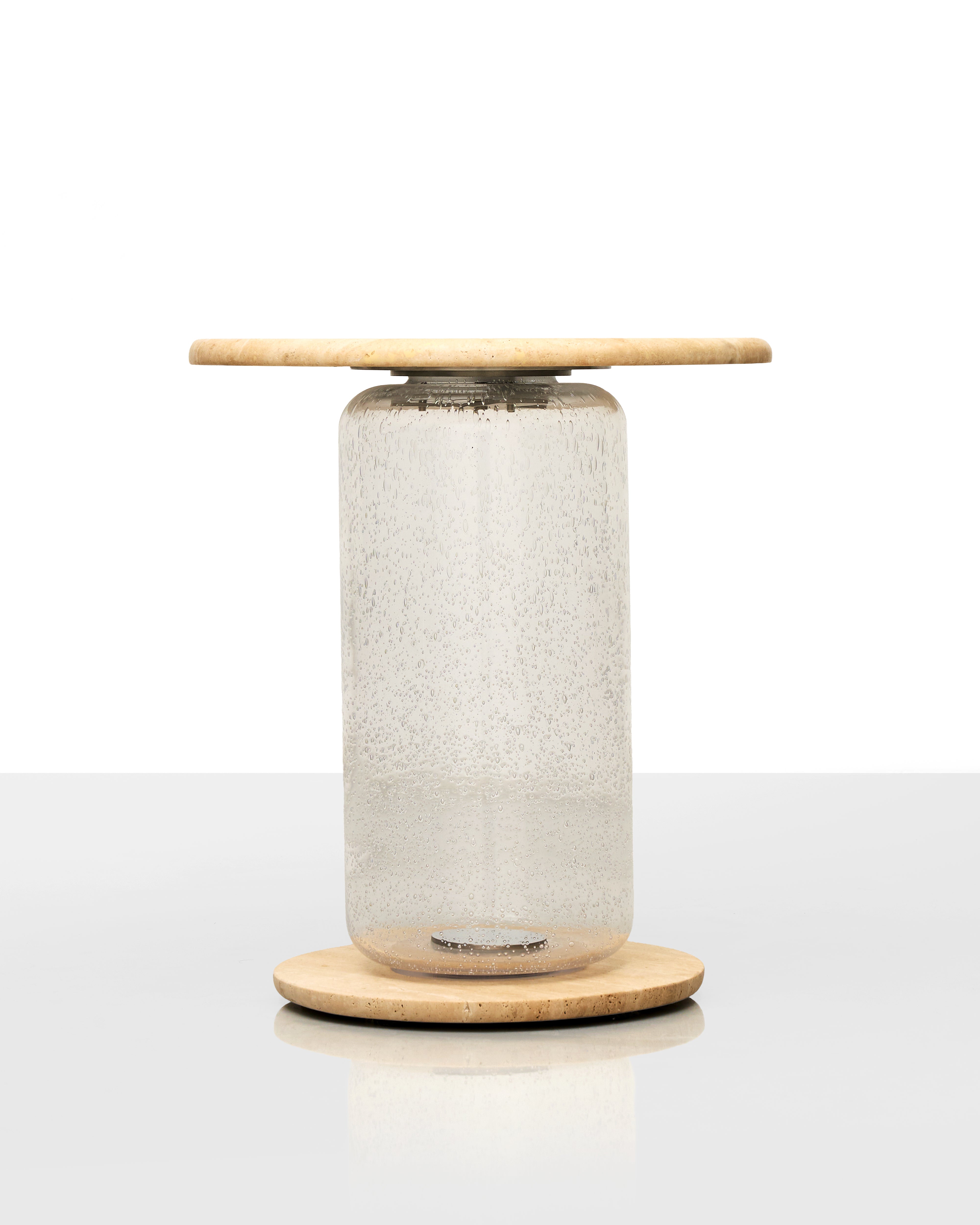 Modern table lamp with a cylindrical glass shade and wooden base on a white background