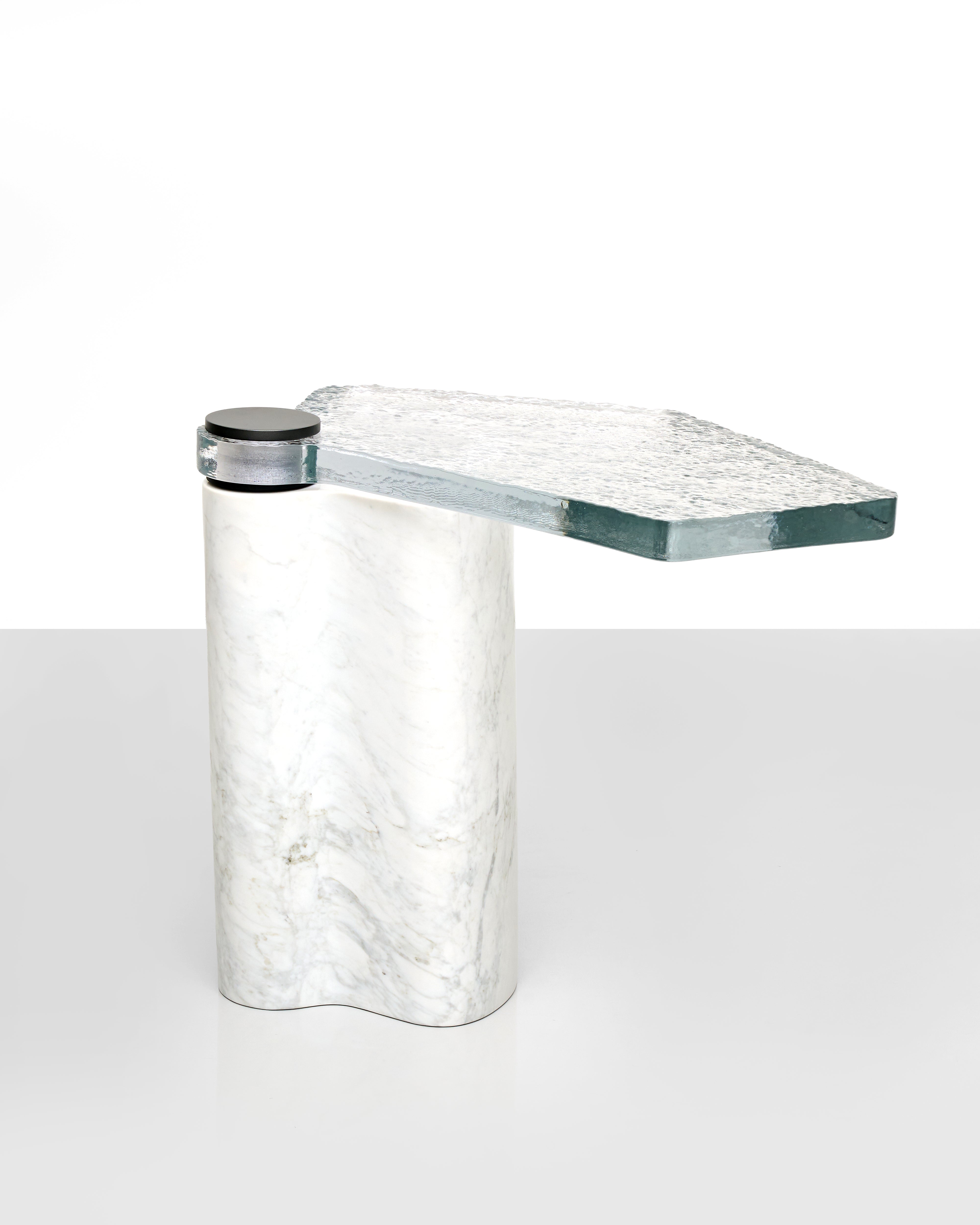 Marble-textured side table with a cylindrical base on a white background