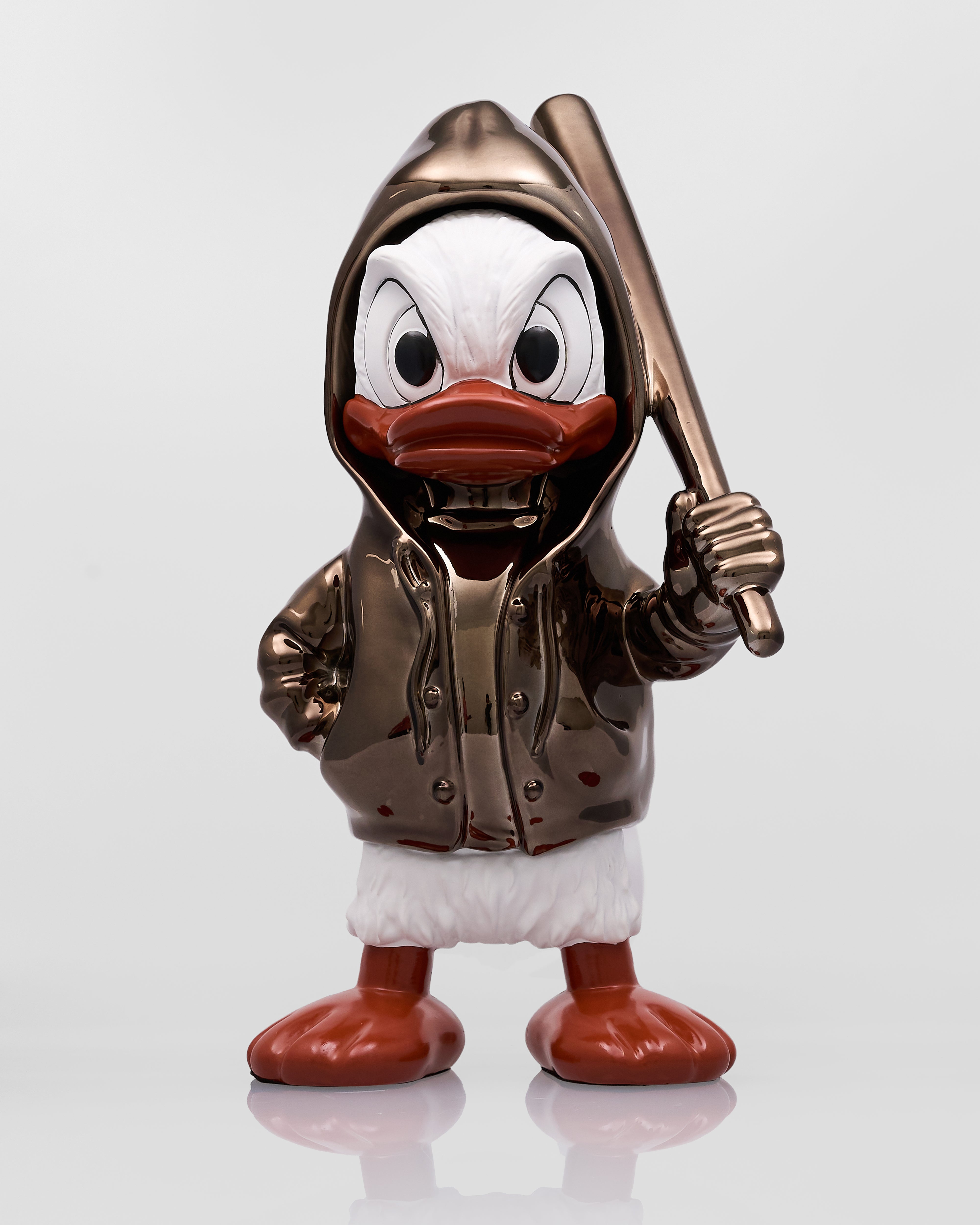 Metallic duck figurine holding a baseball bat on a white background