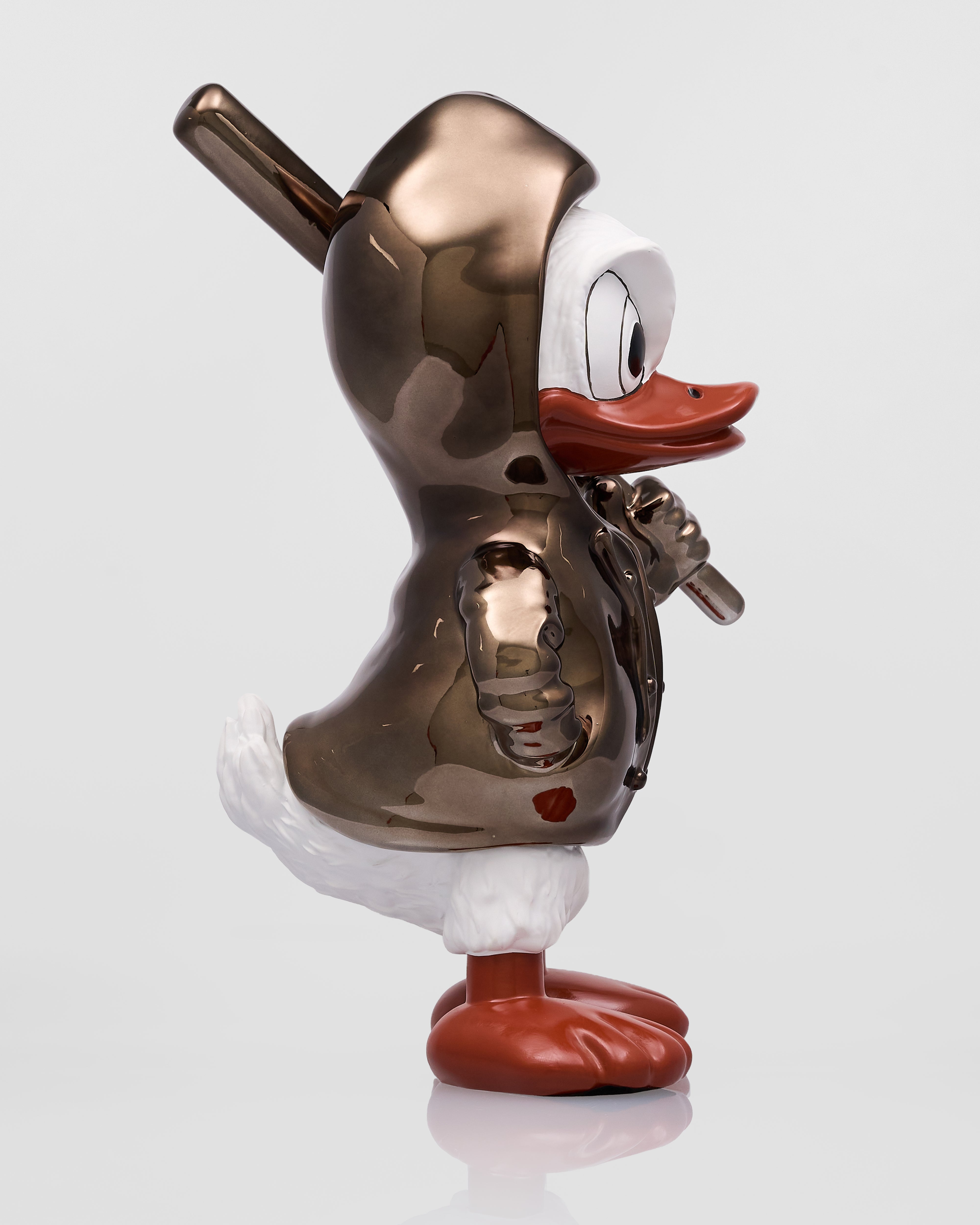 Metallic duck figurine with a unique design on a white background