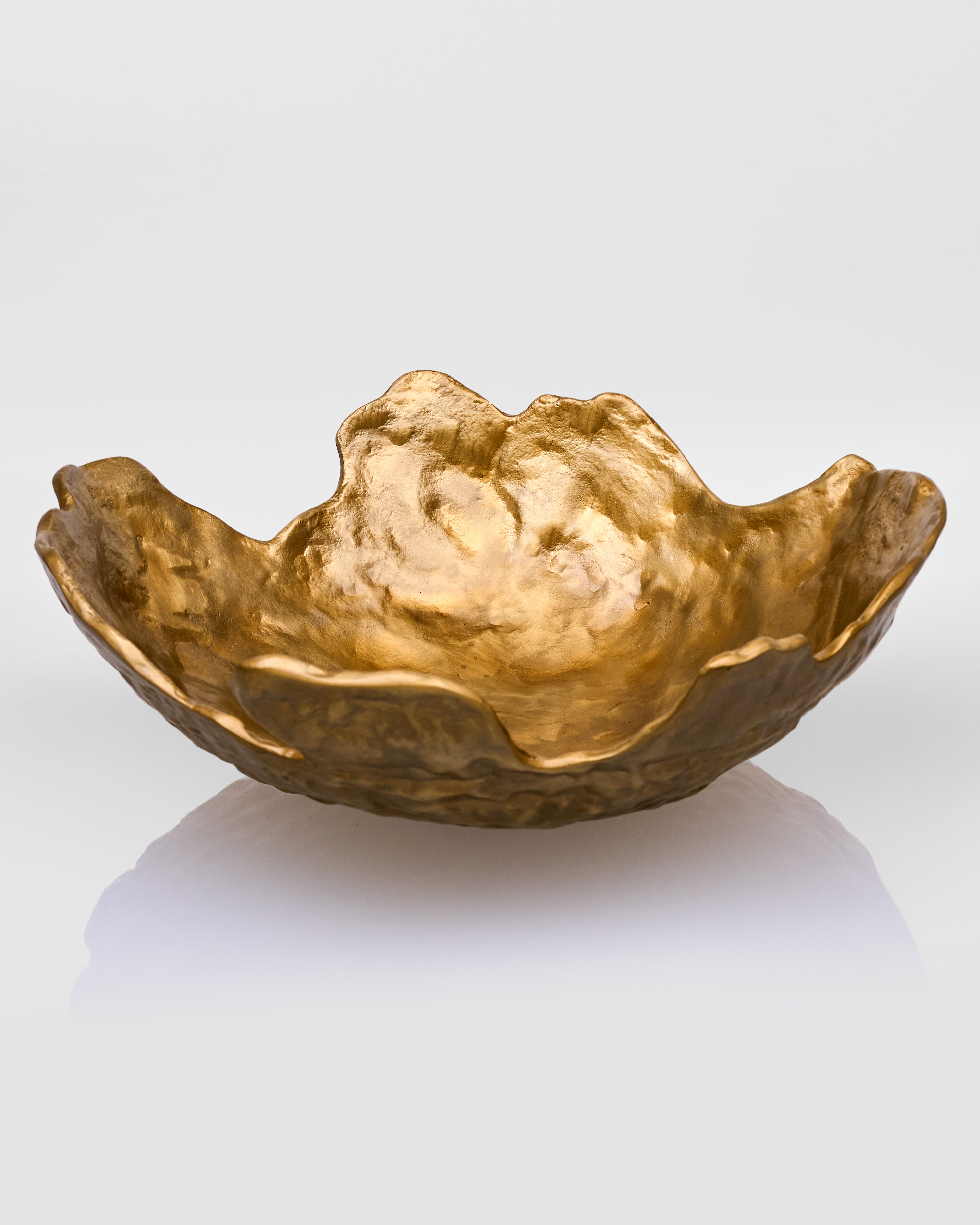 Gold decorative bowl on a white background