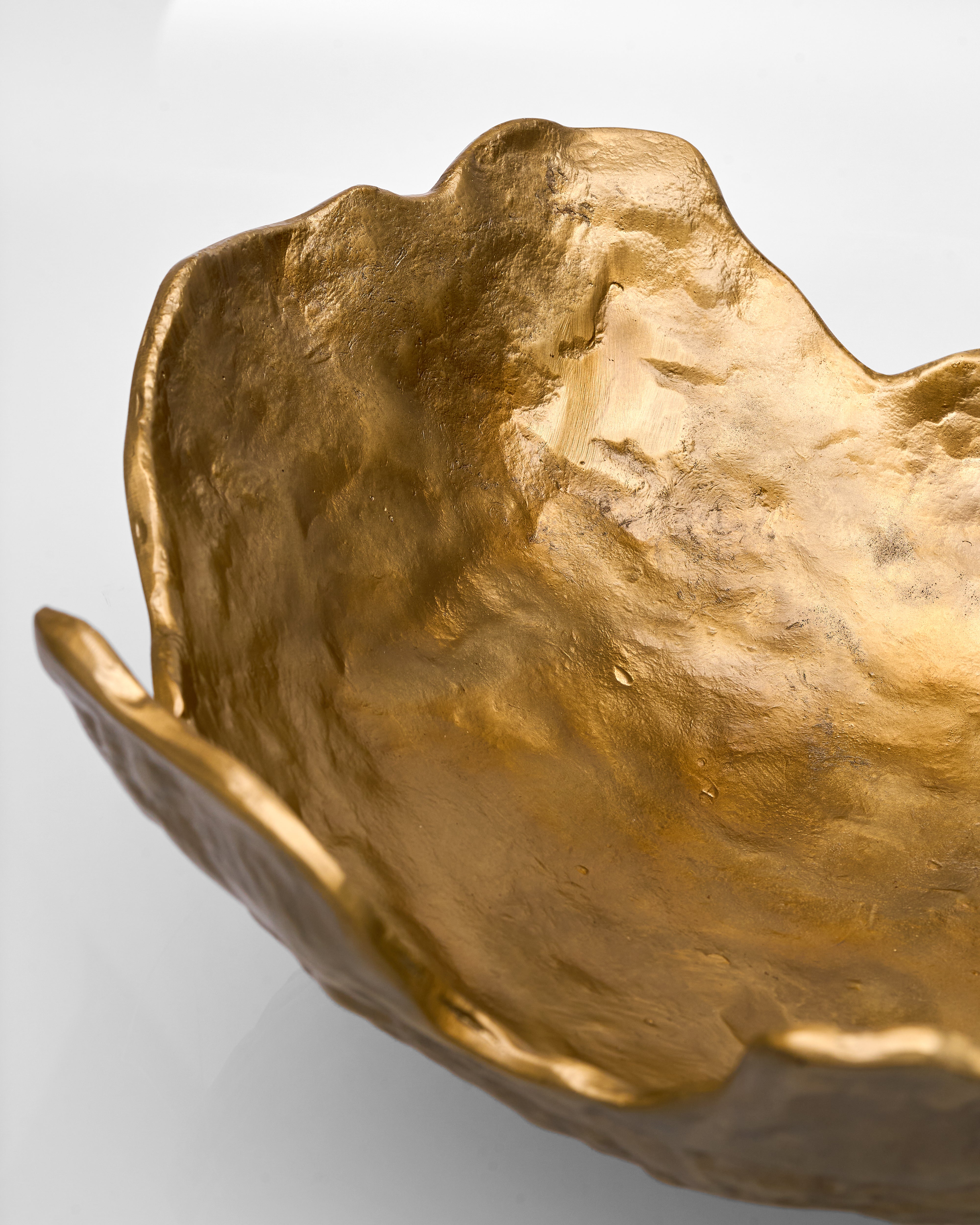 Gold leafed decorative object on a white background
