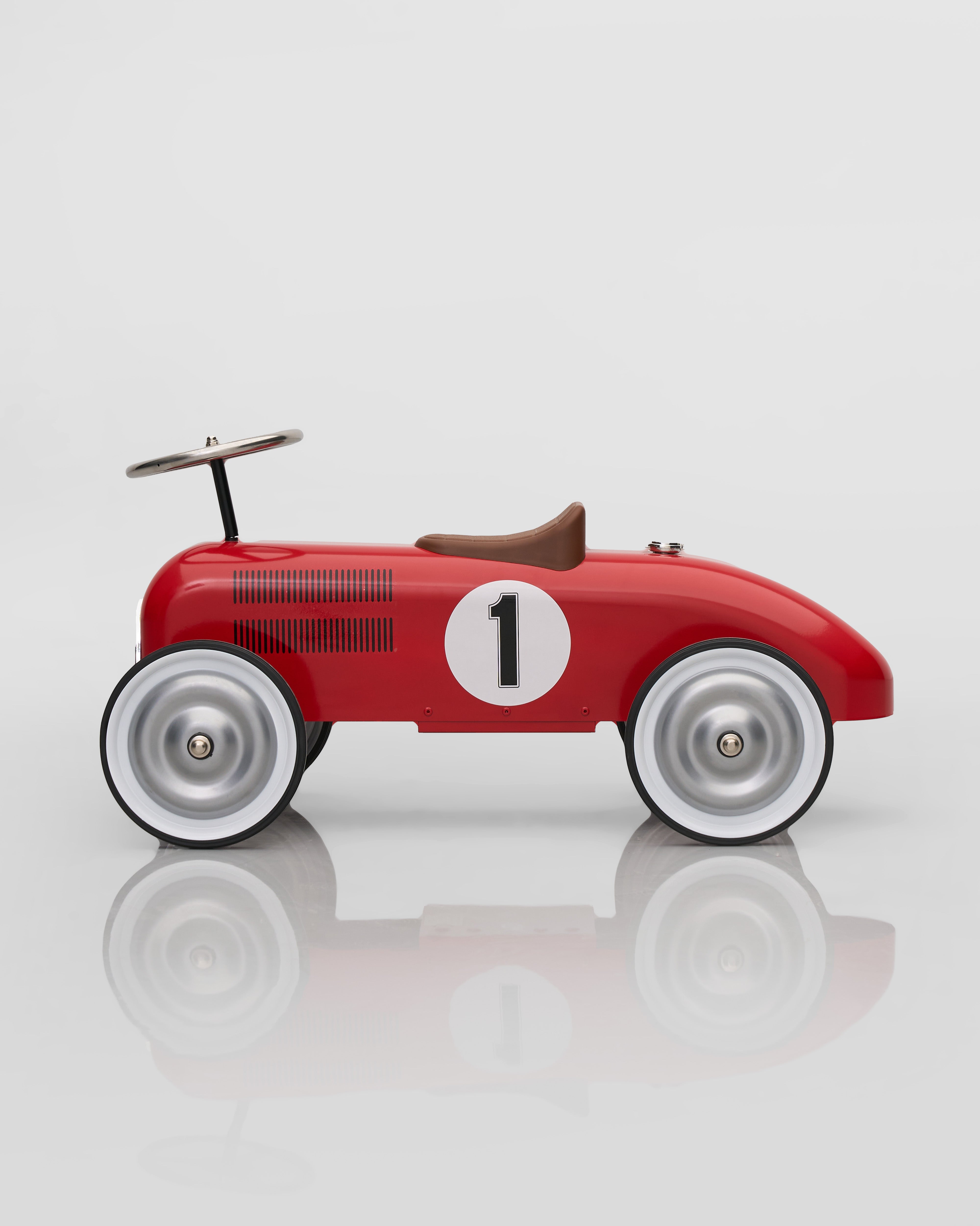 Red toy car decor with a number 1 on a white background