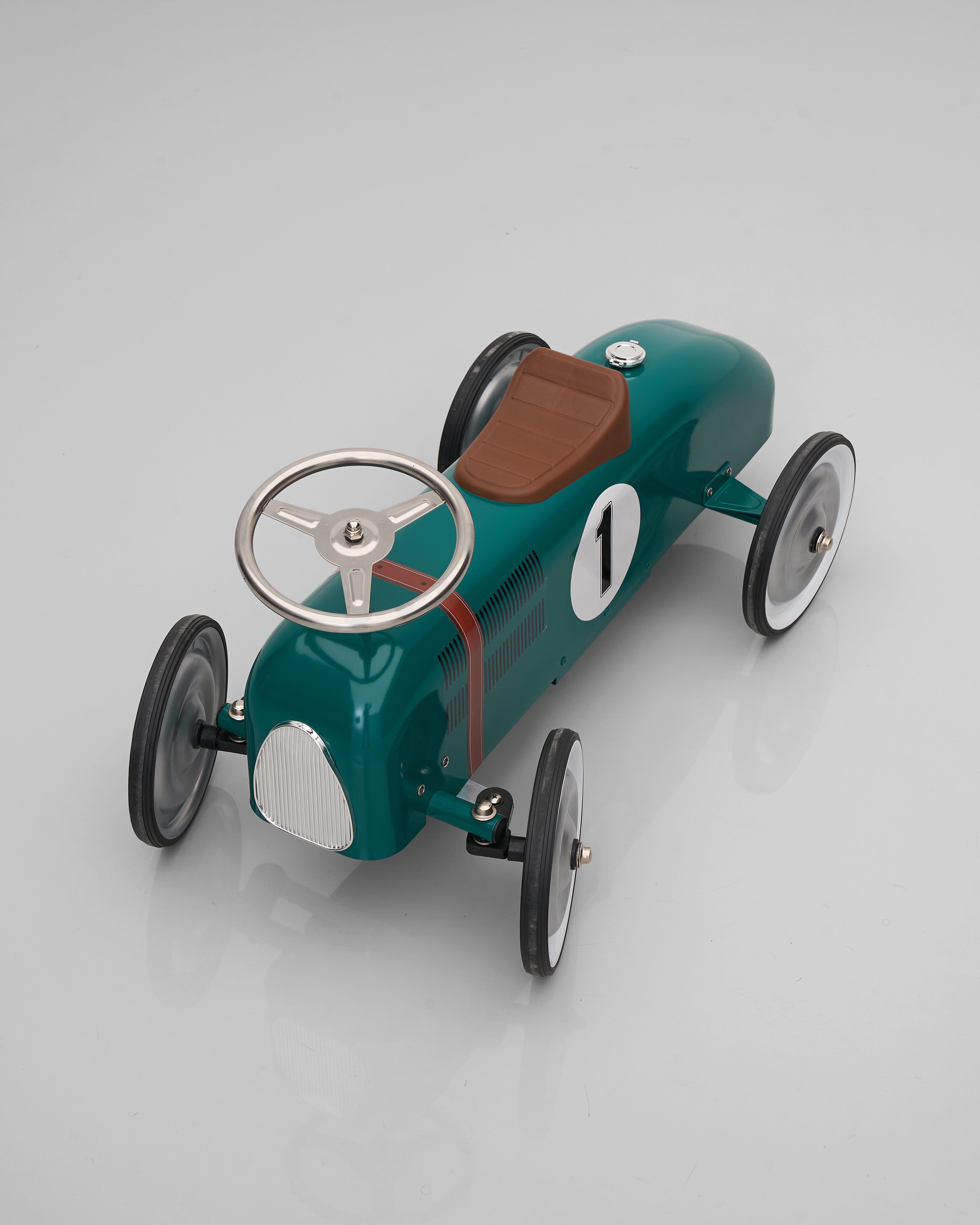 Vintage-style toy race car decor with number 1 on a gray background
