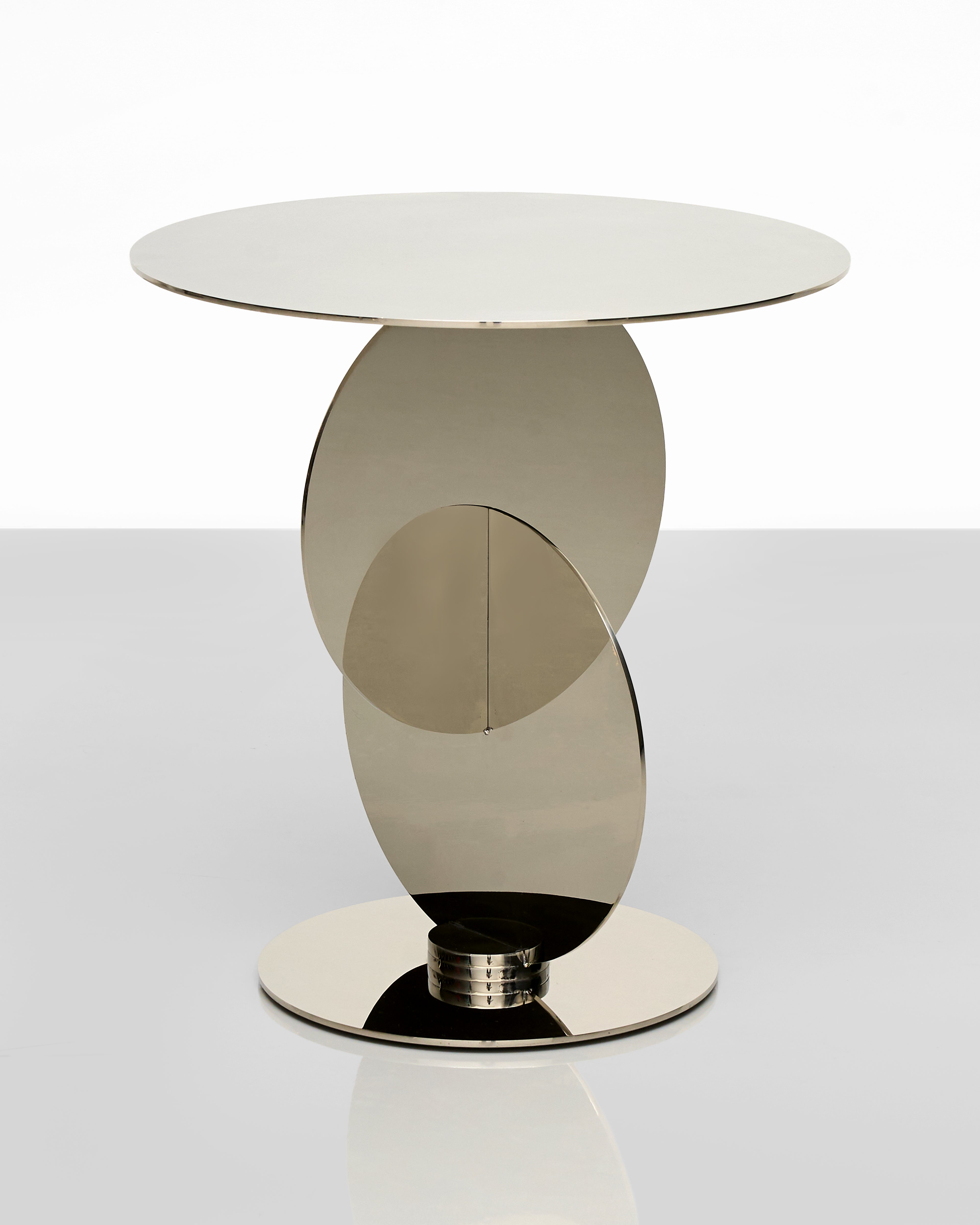 Modern side table with a reflective surface on a white background