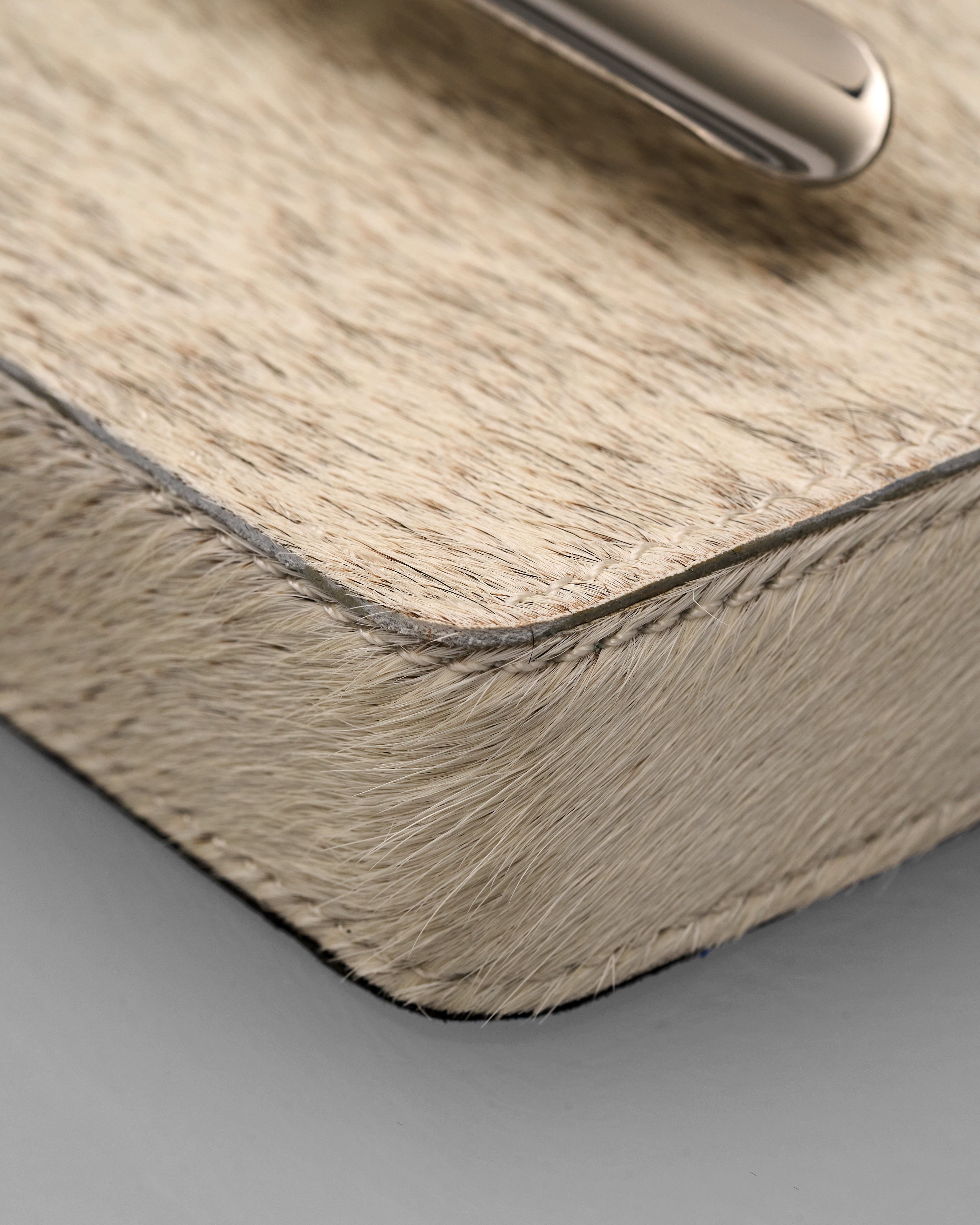 Close-up of a textured surface of Zya Natural Horse Hair Rectangular Ashtray 