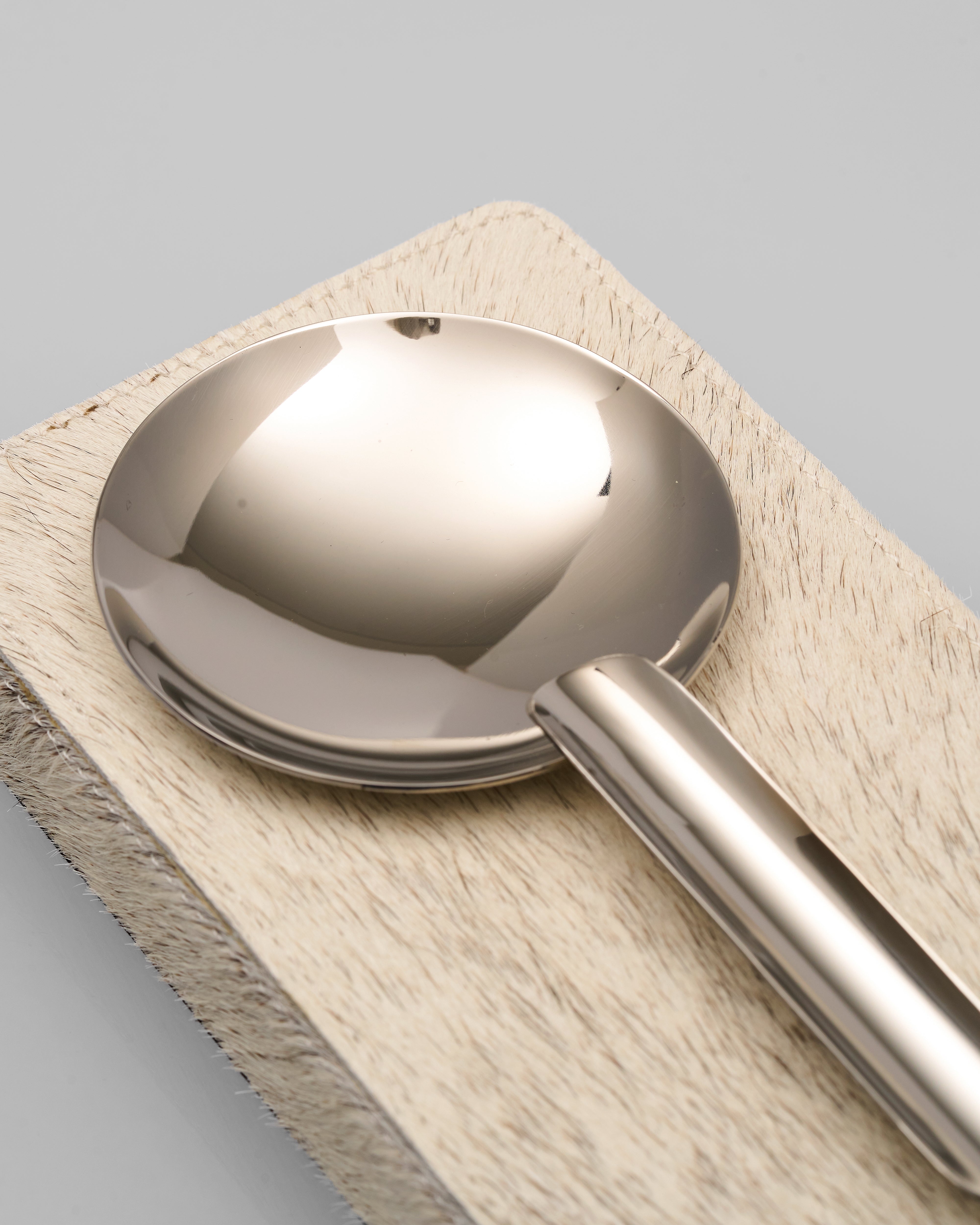 Metallic Zya Natural Horse Hair Rectangular Ashtray on a wooden block with a neutral background