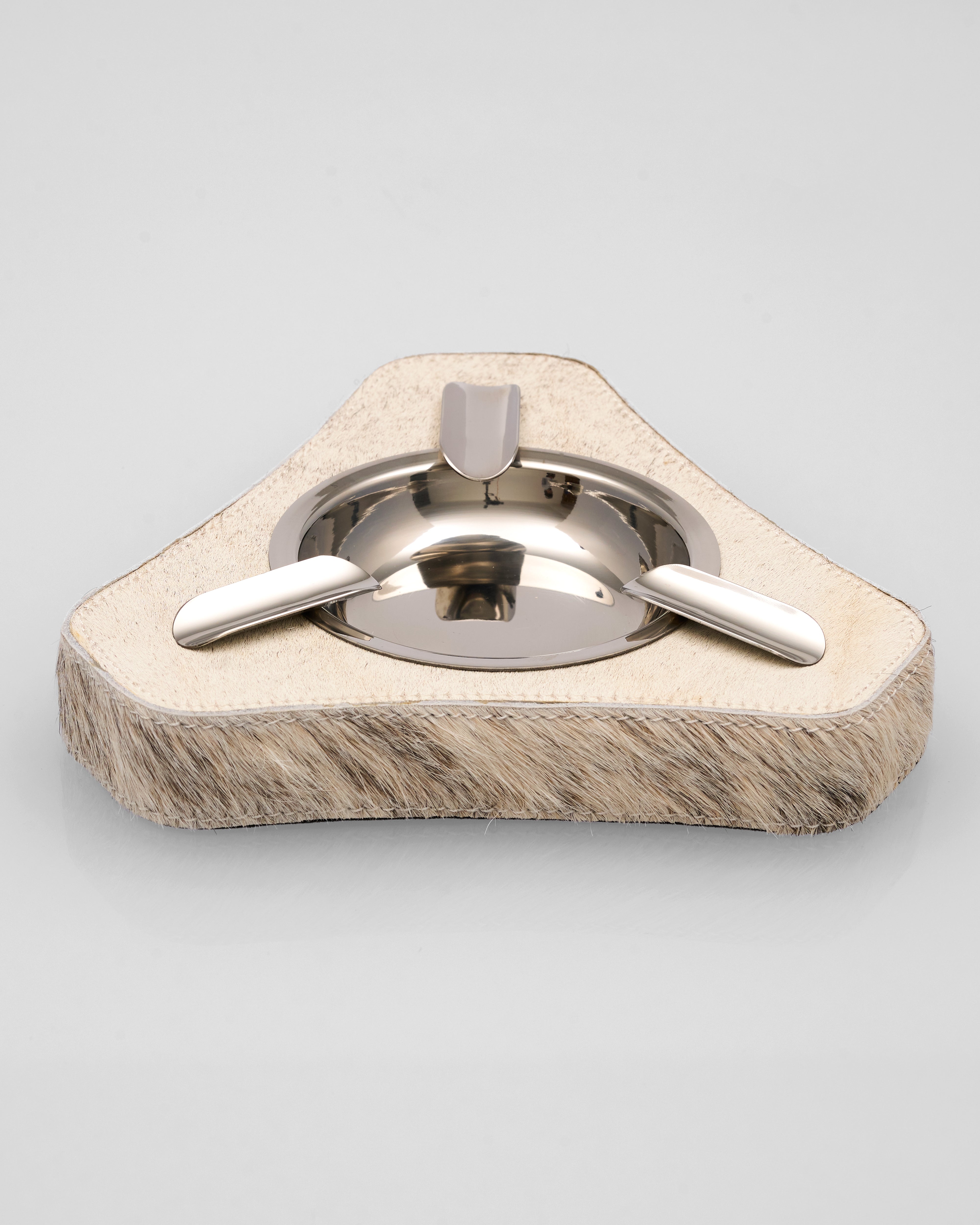 Hexagonal Zya Natural Horse Hair Triangle Ashtray with metal center on a light gray background