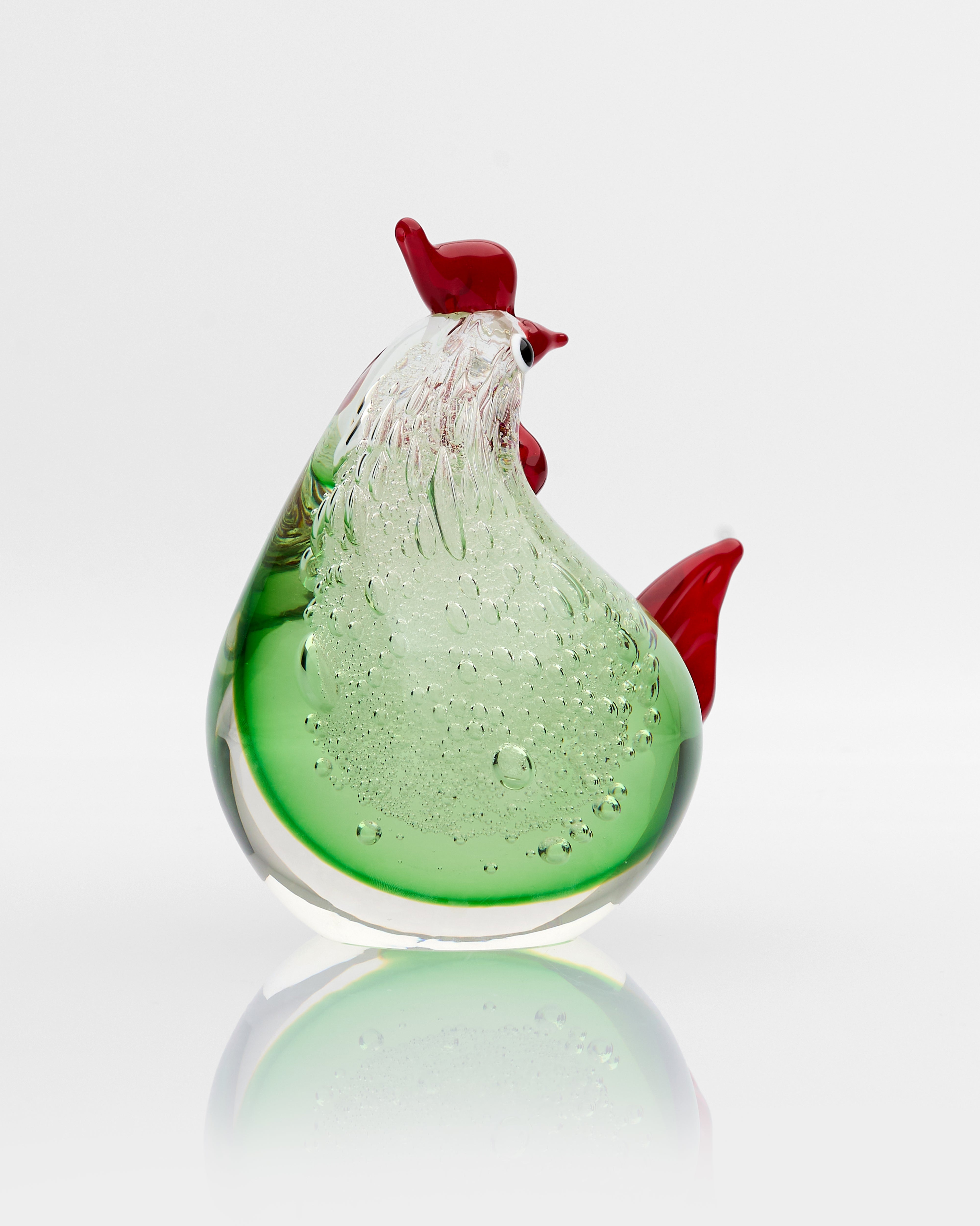 Side view of Aethra tiny hen decor highlighting fine contours and refined craftsmanship
