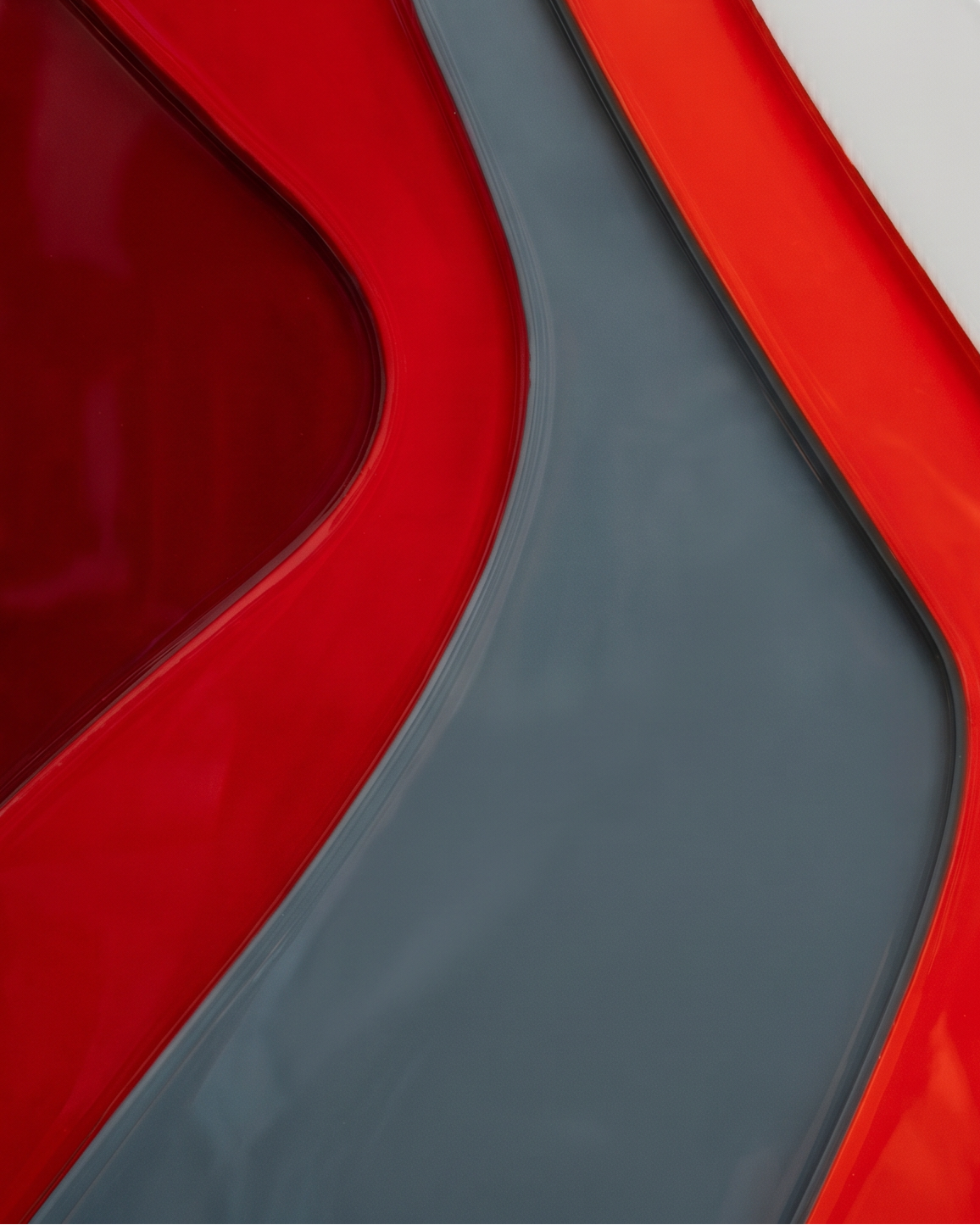 Abstract design with wavy red and gray patterns