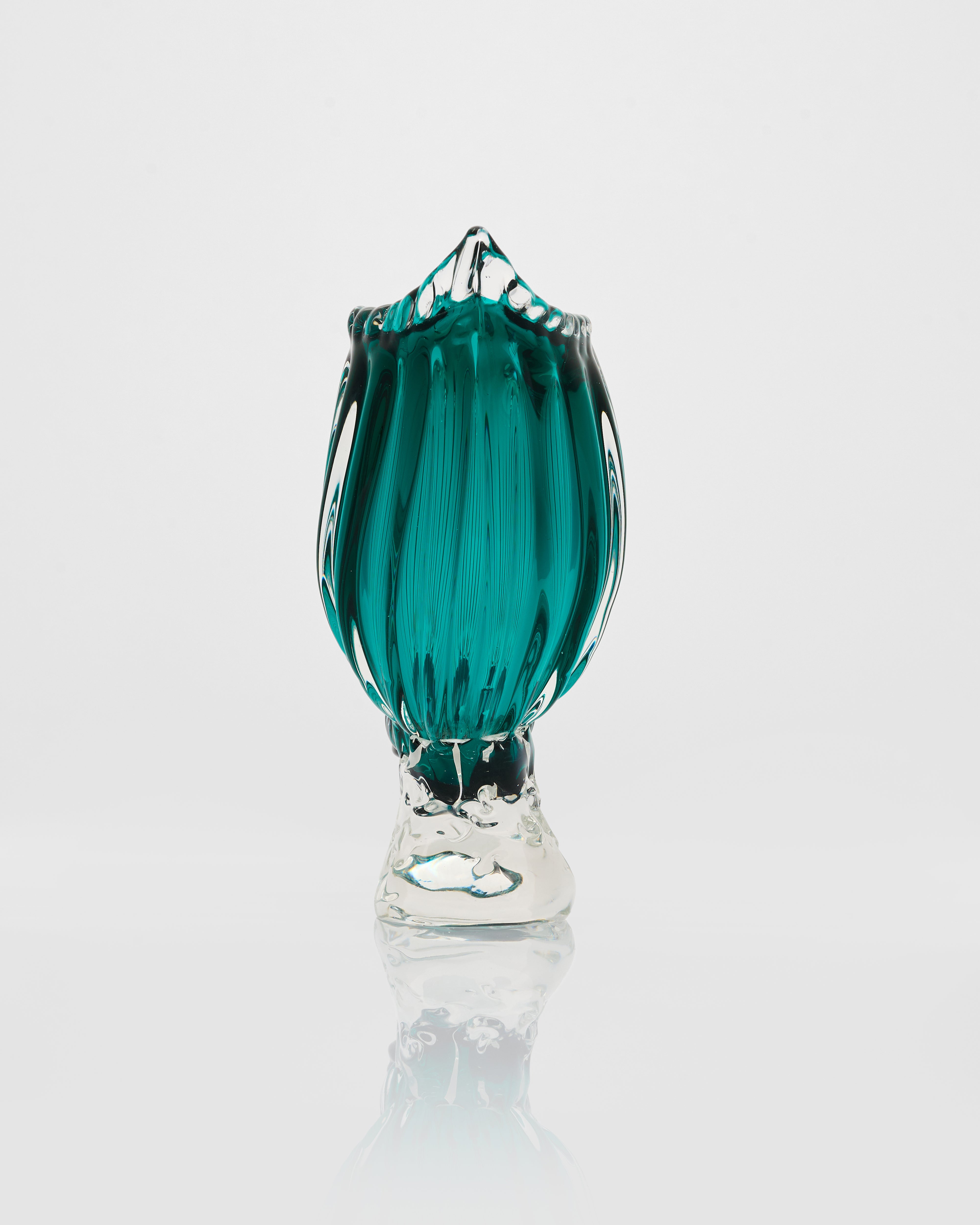 Green glass vase on a white background