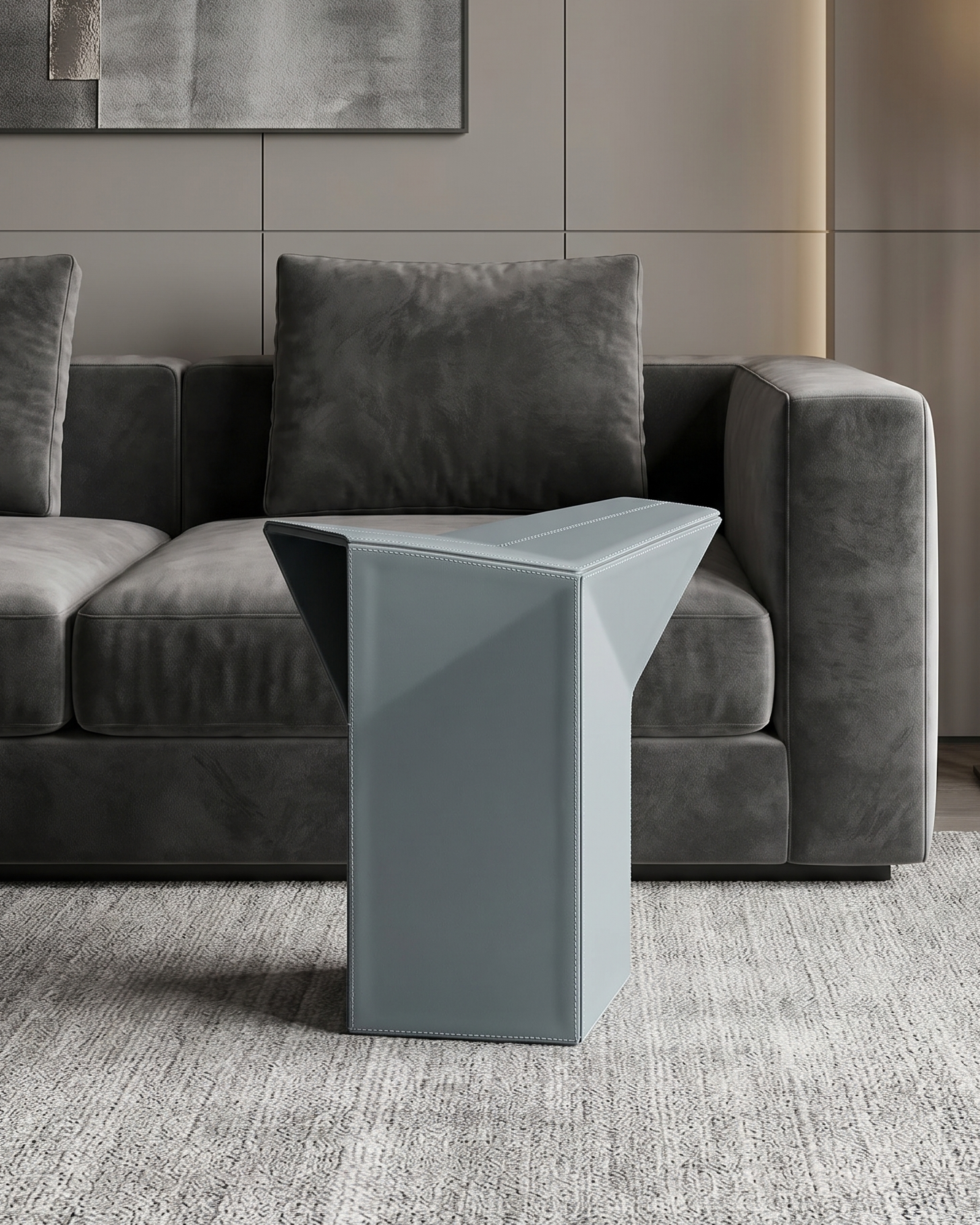 Modern living room with a gray sofa and a stylish side table.
