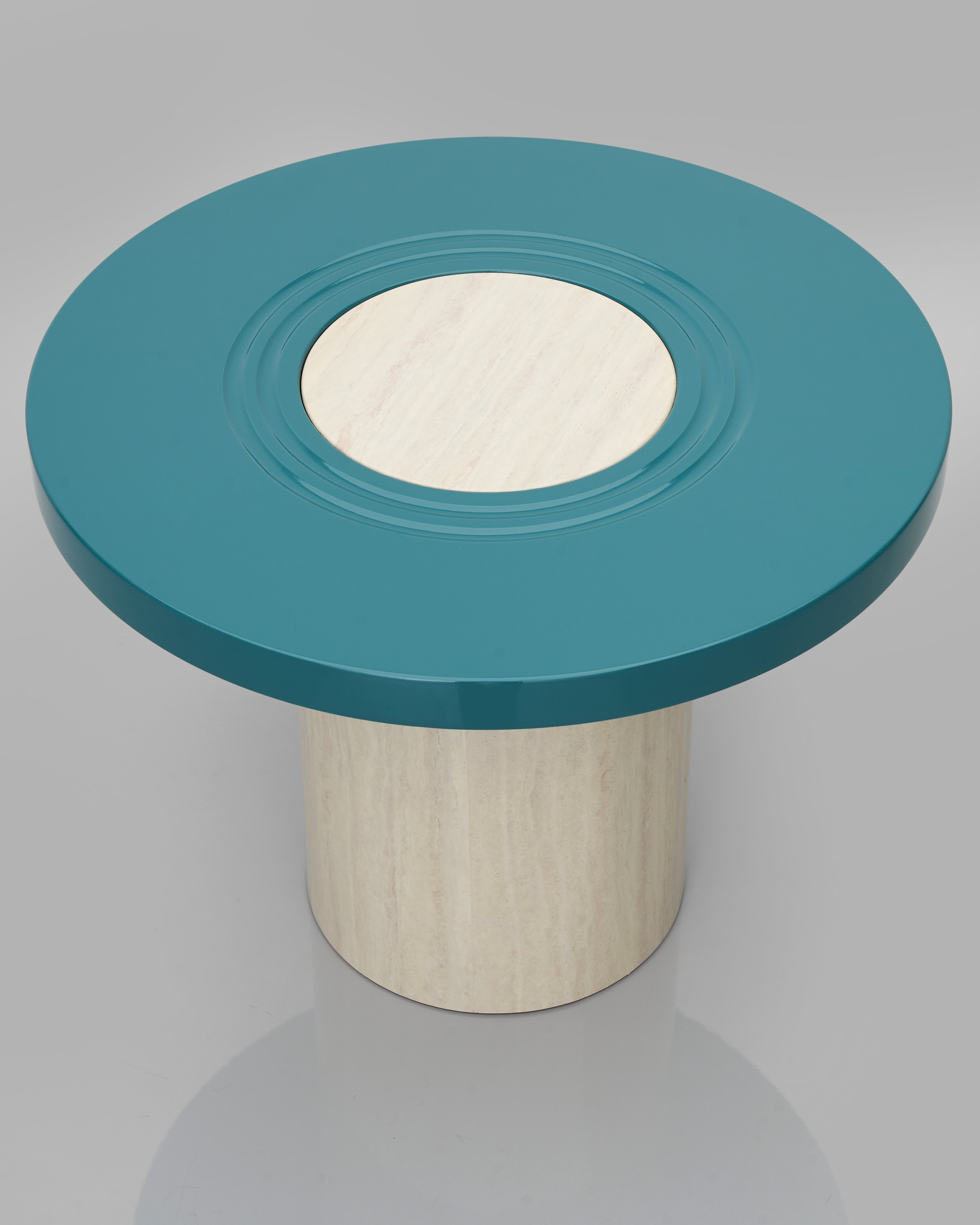 Generica Dual Round Side Table angled view showing sophisticated blue and ivory tones with functional design
