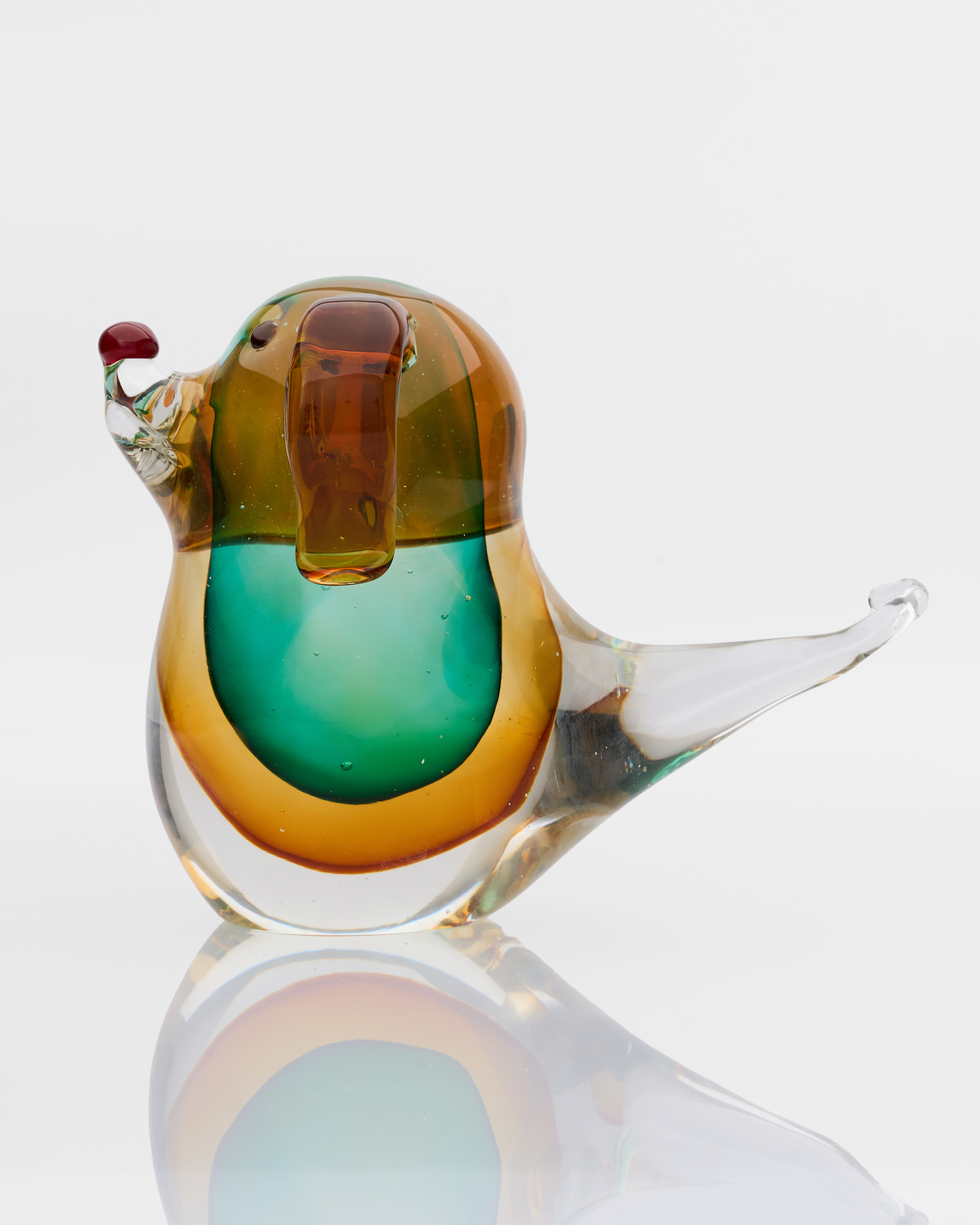 Side view of glossy puppy glass decor highlighting elegant contours and premium glass detailing

