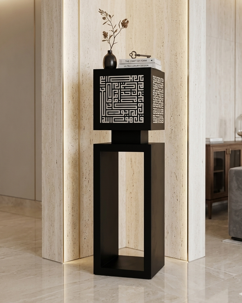 Decorative black pedestal with geometric design in a modern interior setting