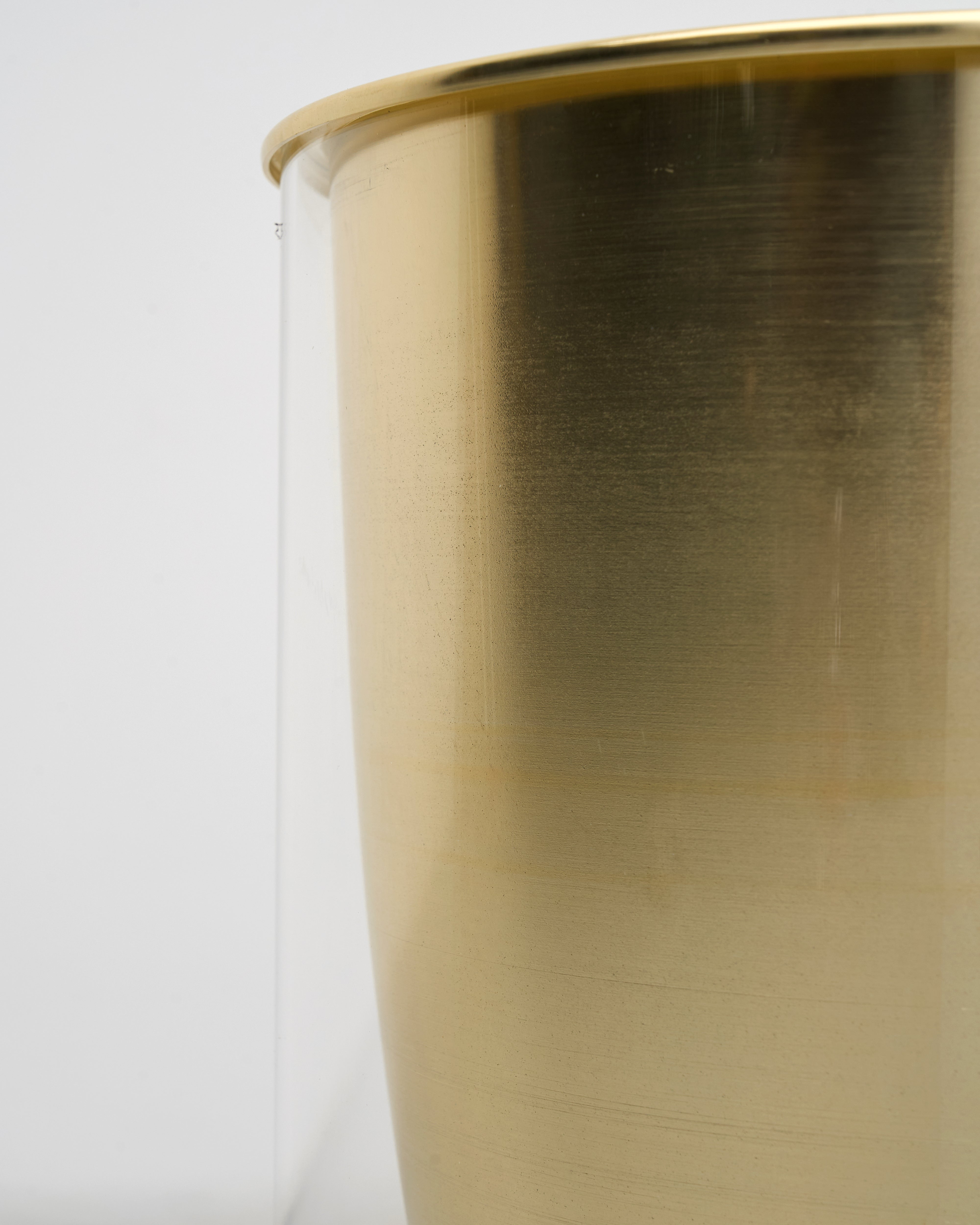 Detailed texture and finish of luxury gold planter set with transparent white base highlighting premium quality and timeless appeal

