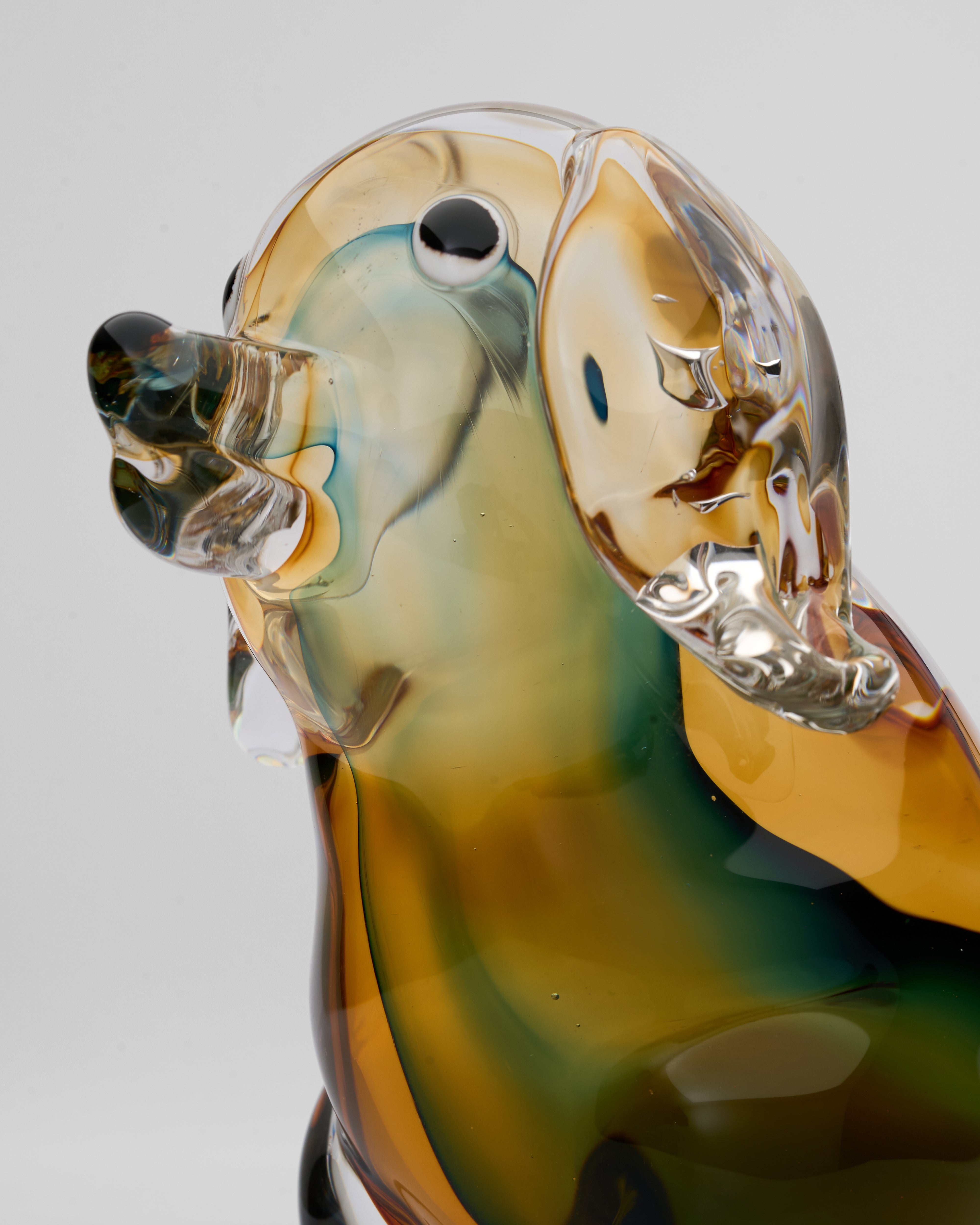 Close-up of Noctyra short puppy glass decor revealing smooth crystal texture and premium polished finish
