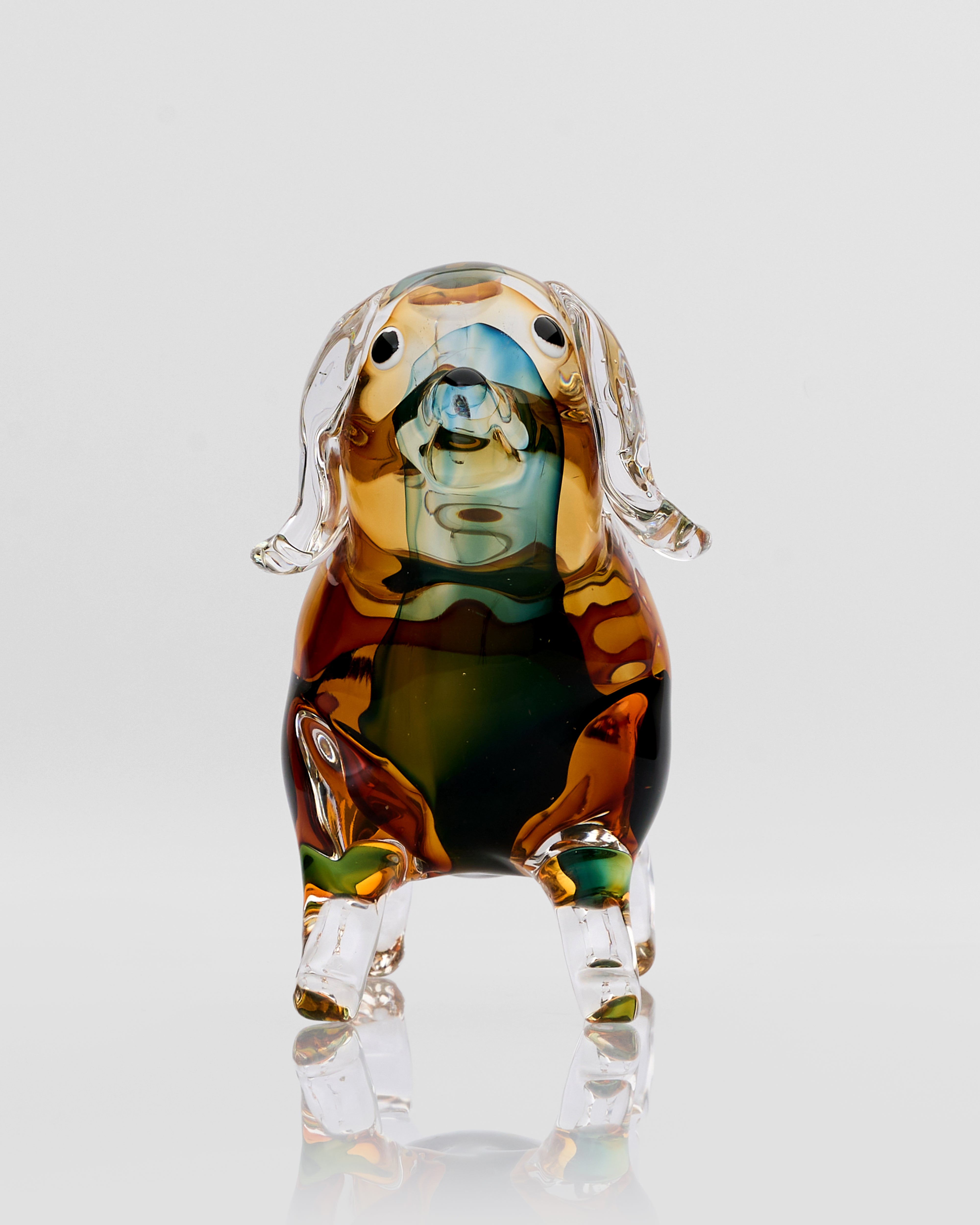 Front view of Noctyra short puppy glass decor showcasing smooth polished finish and charming sculptural details
