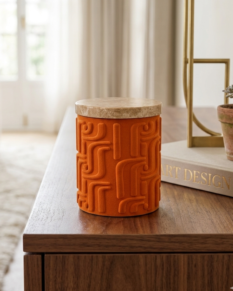 Orange textured jar with wooden lid on a wooden surface in a bright room