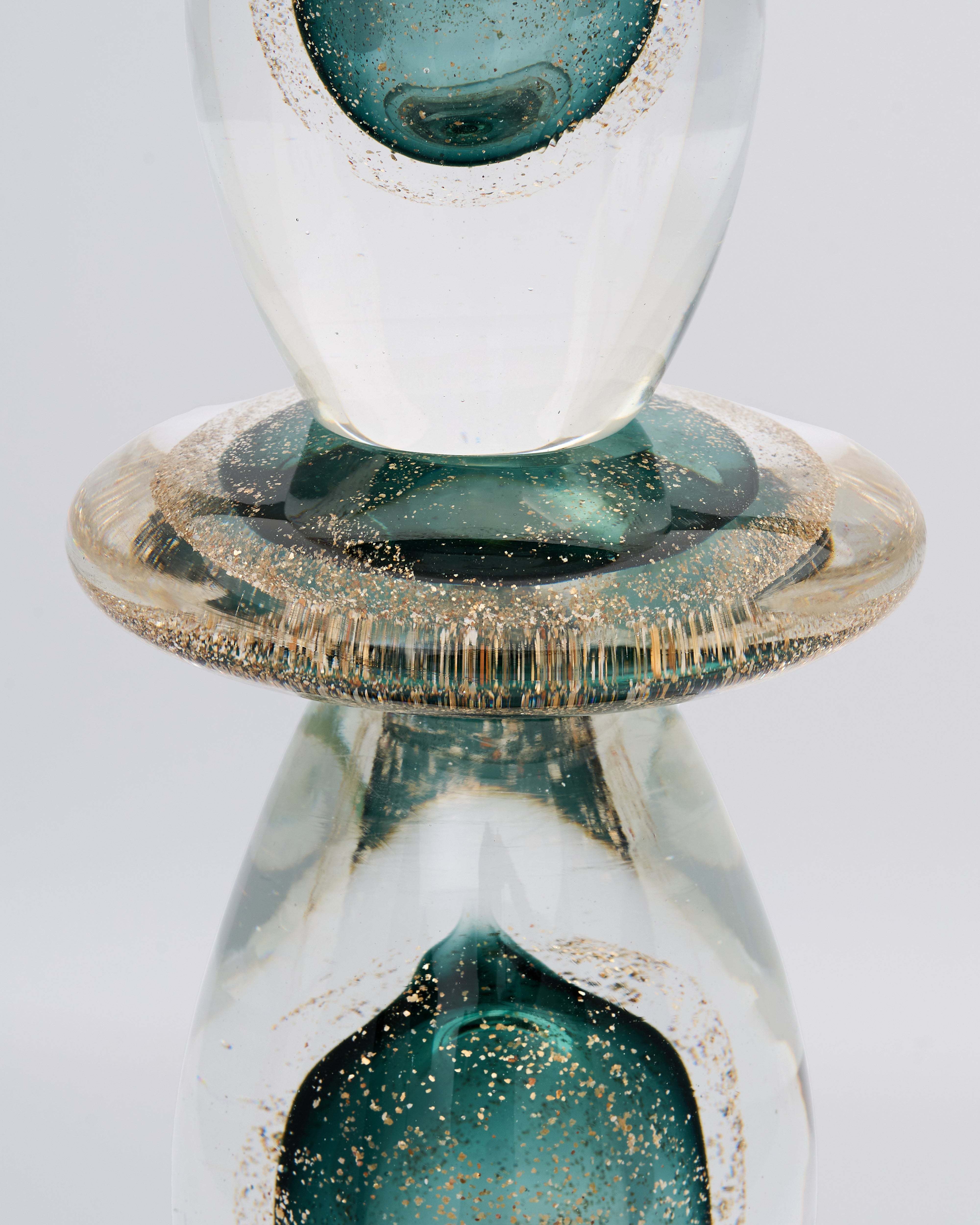 Close-up of Oriona Drop Glass Decor revealing smooth glass texture and fine detailing
