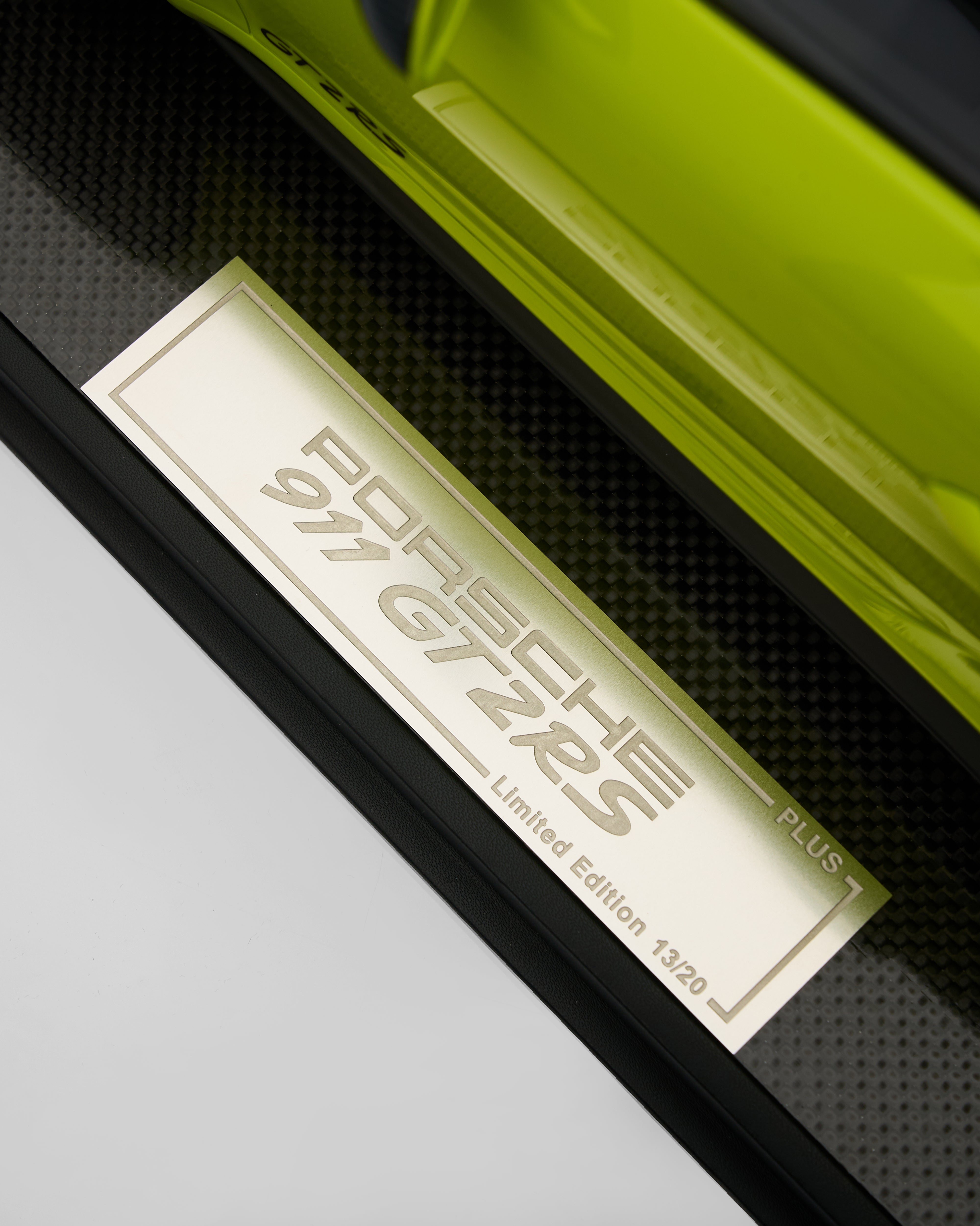 Close-up of a Porsche 911 GT2 RS Limited Edition badge on a car door.