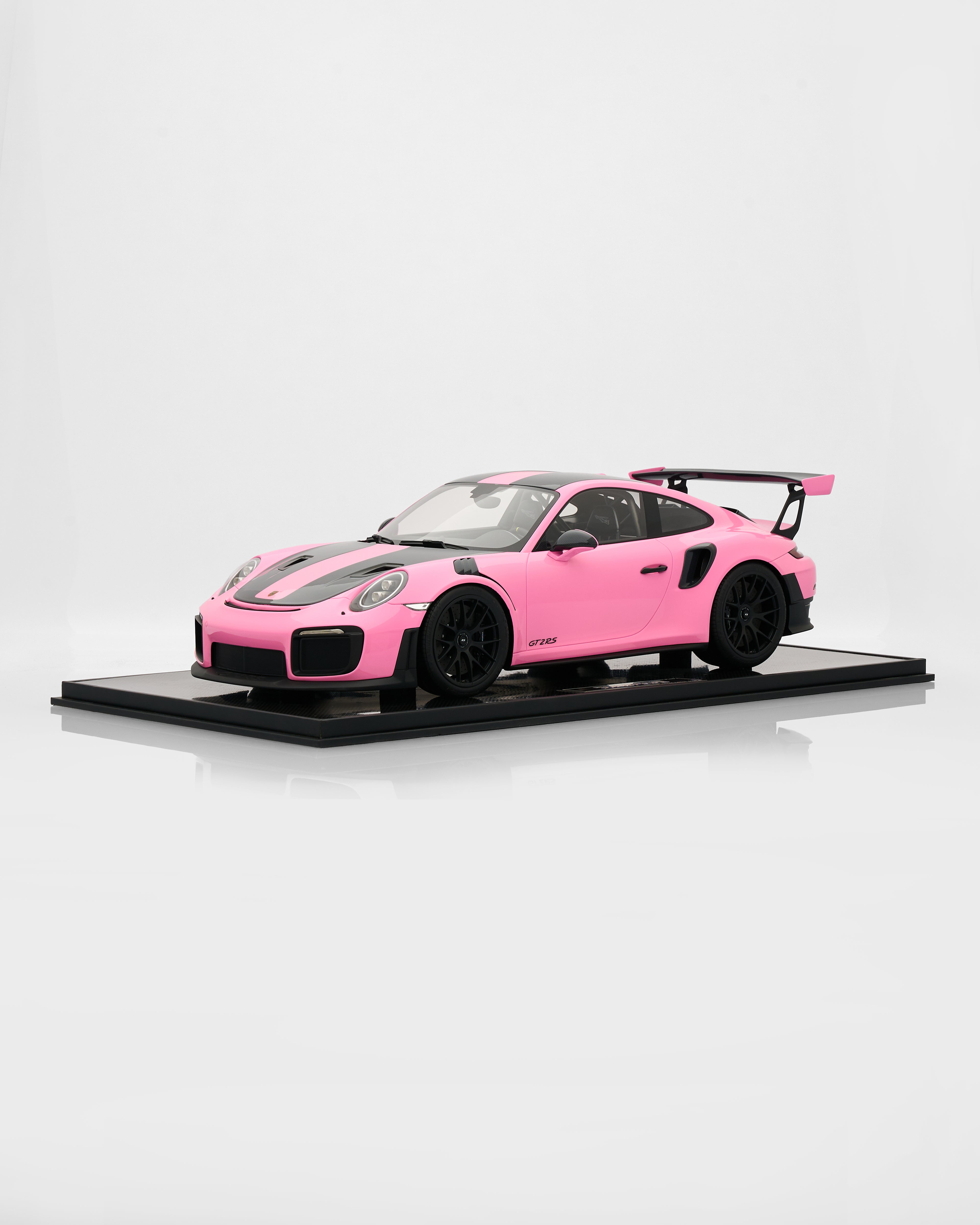 Side view of Porsche 911 GT2RS Gloss Pink 1:18 scale model highlighting aggressive stance and premium detailing
