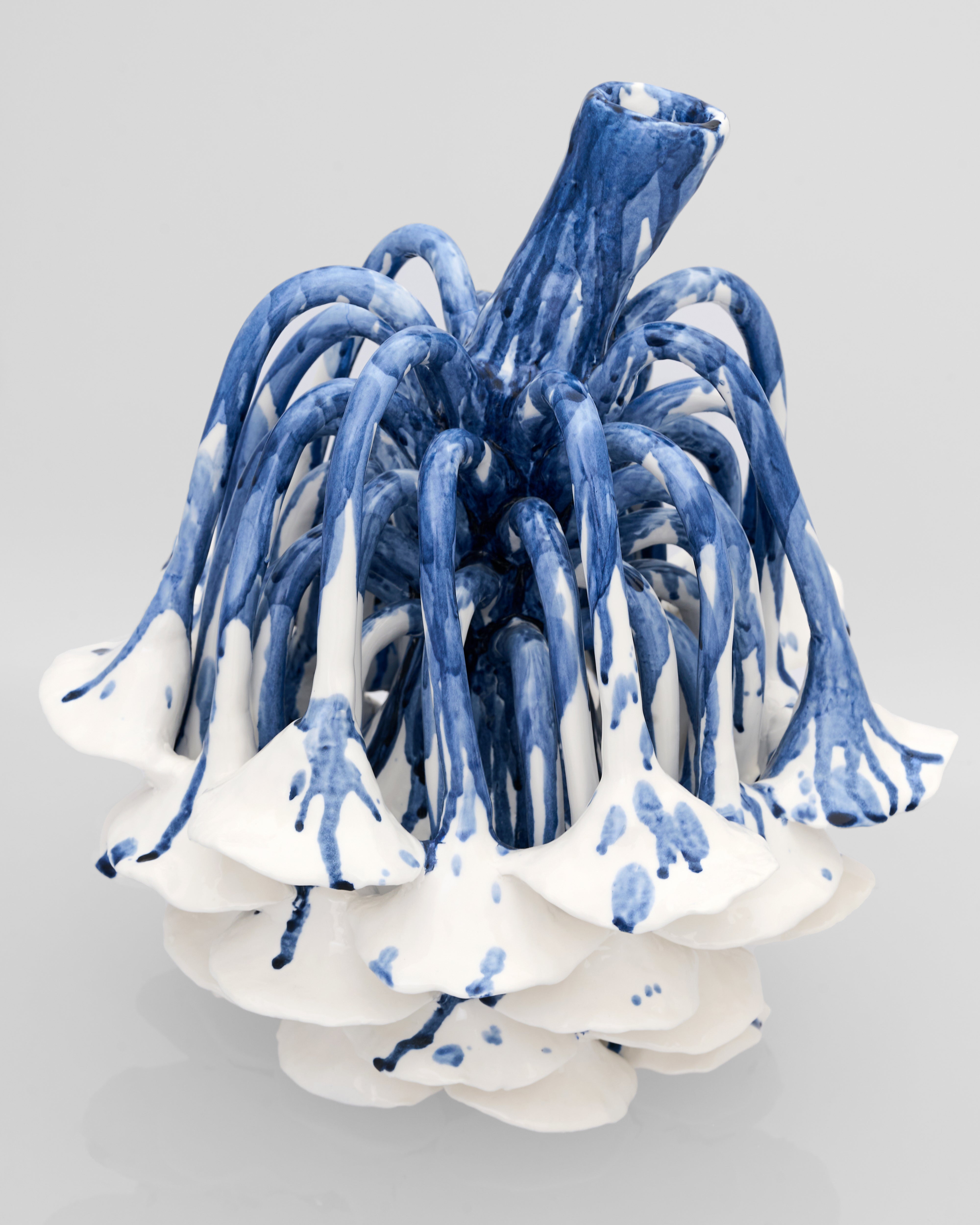 Front view of Radicle Decor with porcelain-like metal finish showcasing elegant sculptural form and premium texture
