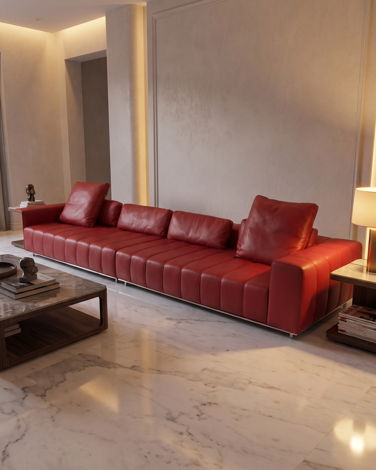 A modern red leather sectional sofa with tufted channel stitching and matching back cushions, styled in a contemporary living room with a marble floor, side tables, and a lamp.