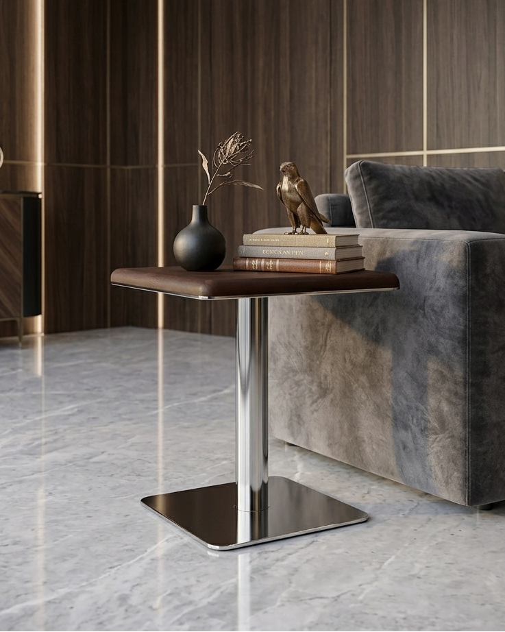 Modern living room with a gray sofa, wooden side table, and decorative items.