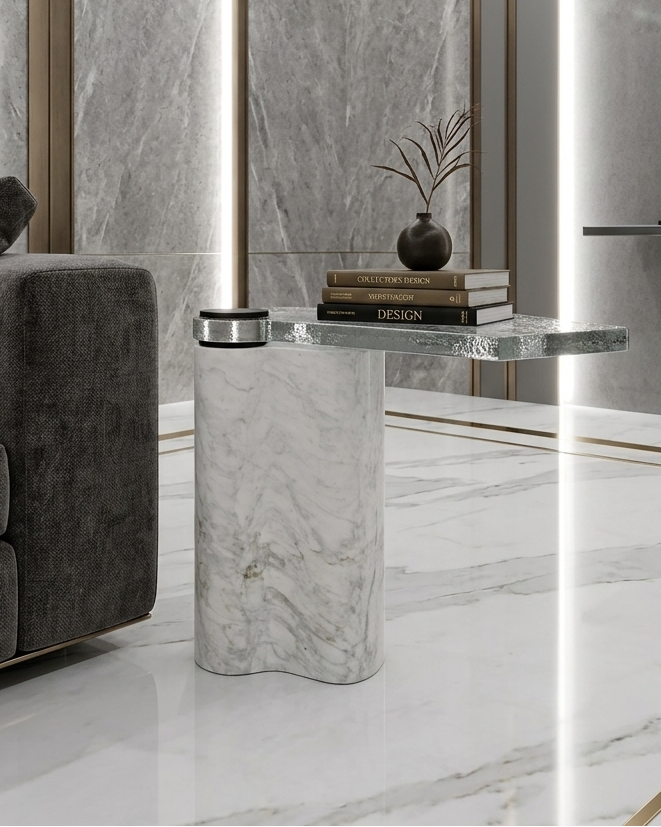 Modern living room with gray sofa, marble side table, and decorative elements.