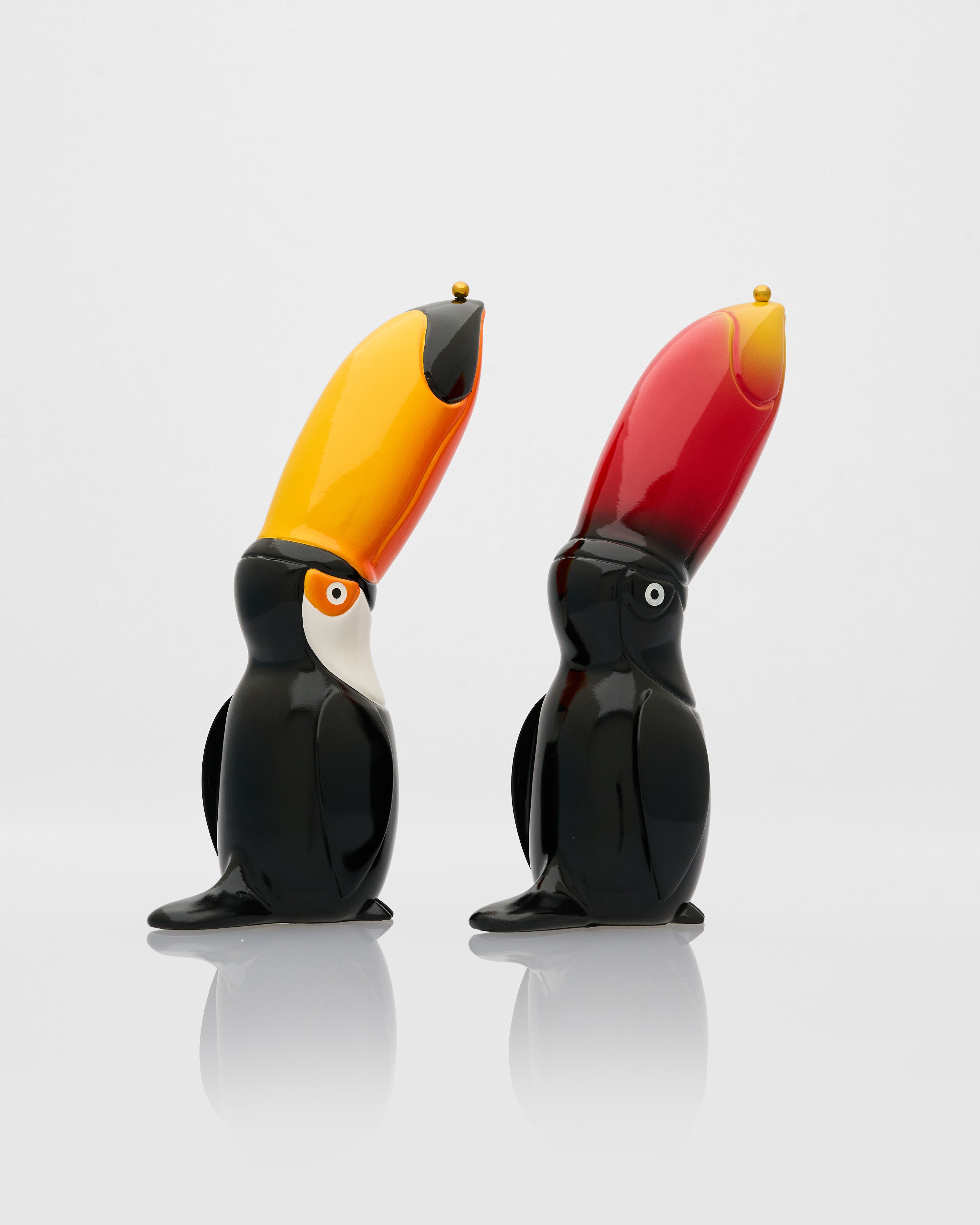 Side view of toucans figurine pair highlighting sculptural form and premium decorative detailing
