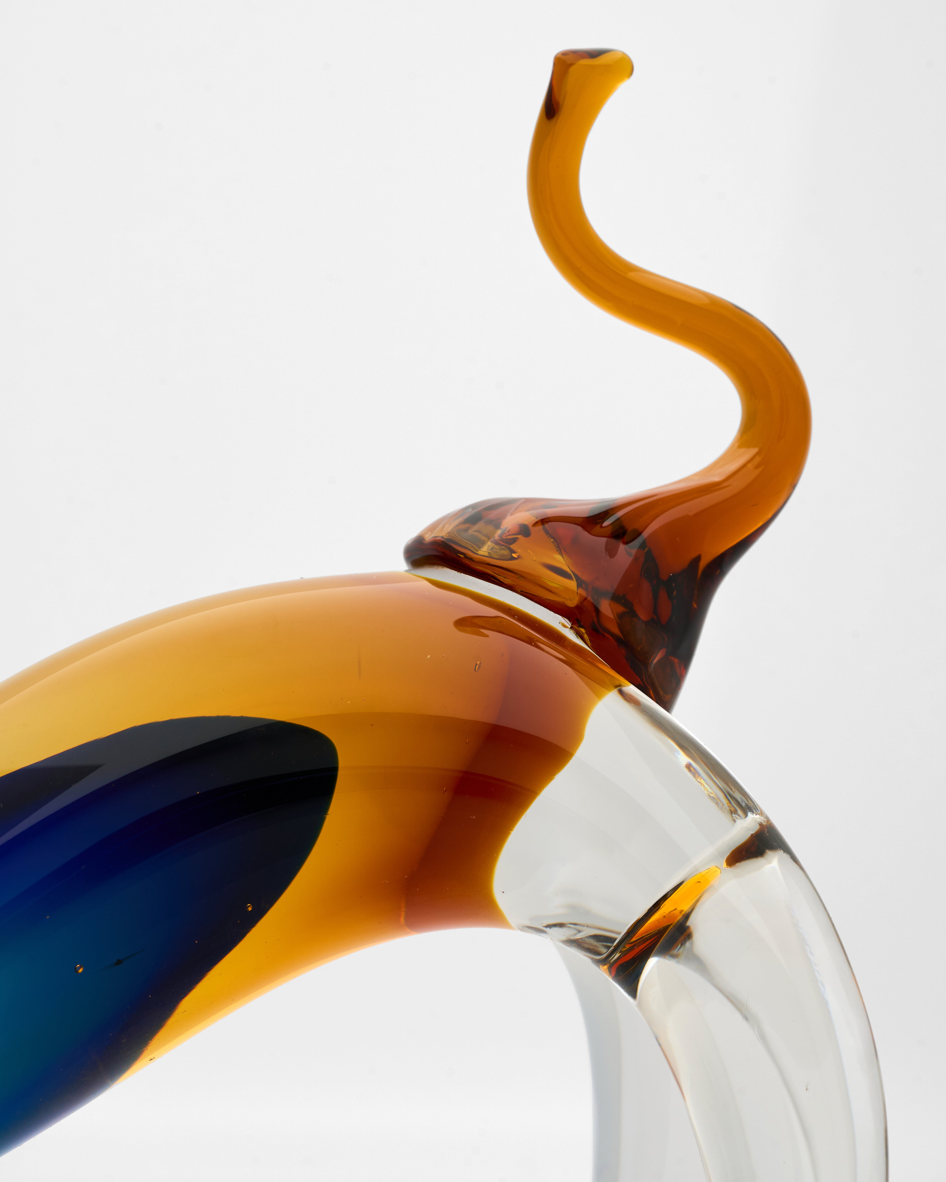 Glass object with a twisted design on a white background