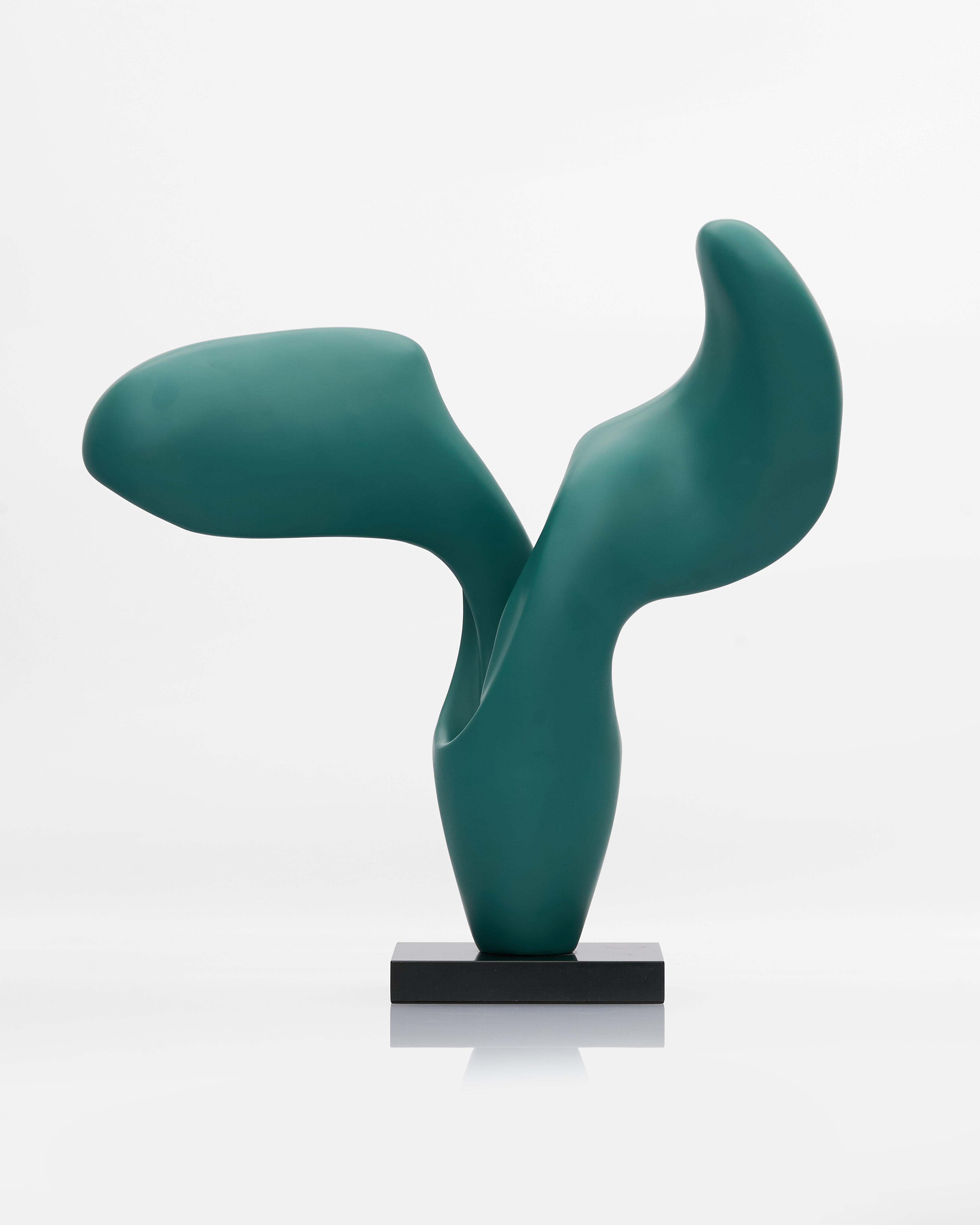 Side view of V Wave Sculpture highlighting flowing contours and premium fiber material finish
